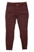The Kuhl Womens Brooke Skinny Pants in maroon, made from stretch canvas with a skinny fit, front pockets, and button closure, are laid flat on a white background.