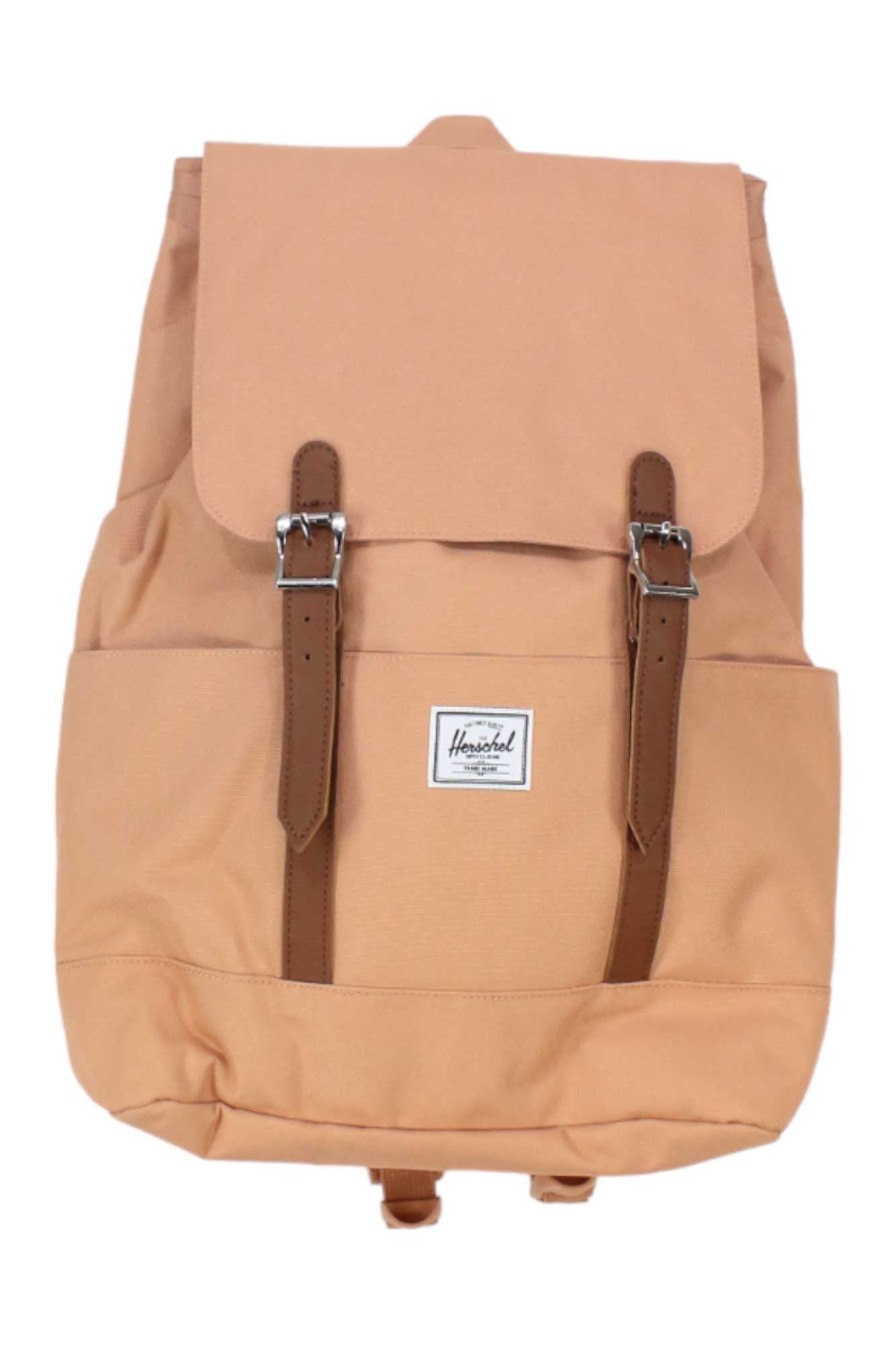The Herschel Supply Company Retreat Small Backpack in tan features EcoSystem recycled fabric, a flap top, two brown buckle straps, and a small white rectangular logo patch on the front pocket.