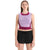 A woman with straight brown hair wears the Icebreaker Womens ZoneKnit Cropped Bra-Tank in two-tone purple and maroon, made from breathable fabric, paired with black shorts, standing against a plain white background.
