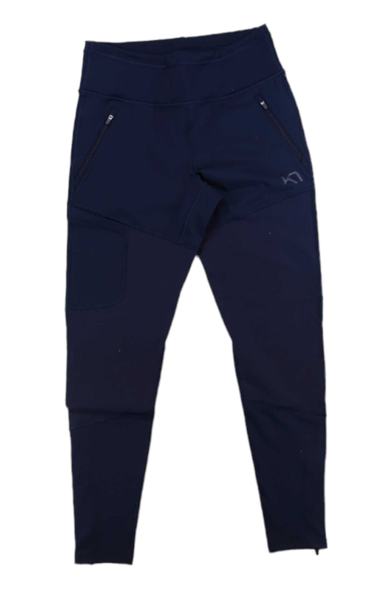 The Kari Traa Womens Sanne Tight in navy blue features 4-way stretch, zippered pockets on both sides, and a right thigh patch pocket, shown flat against a white background.