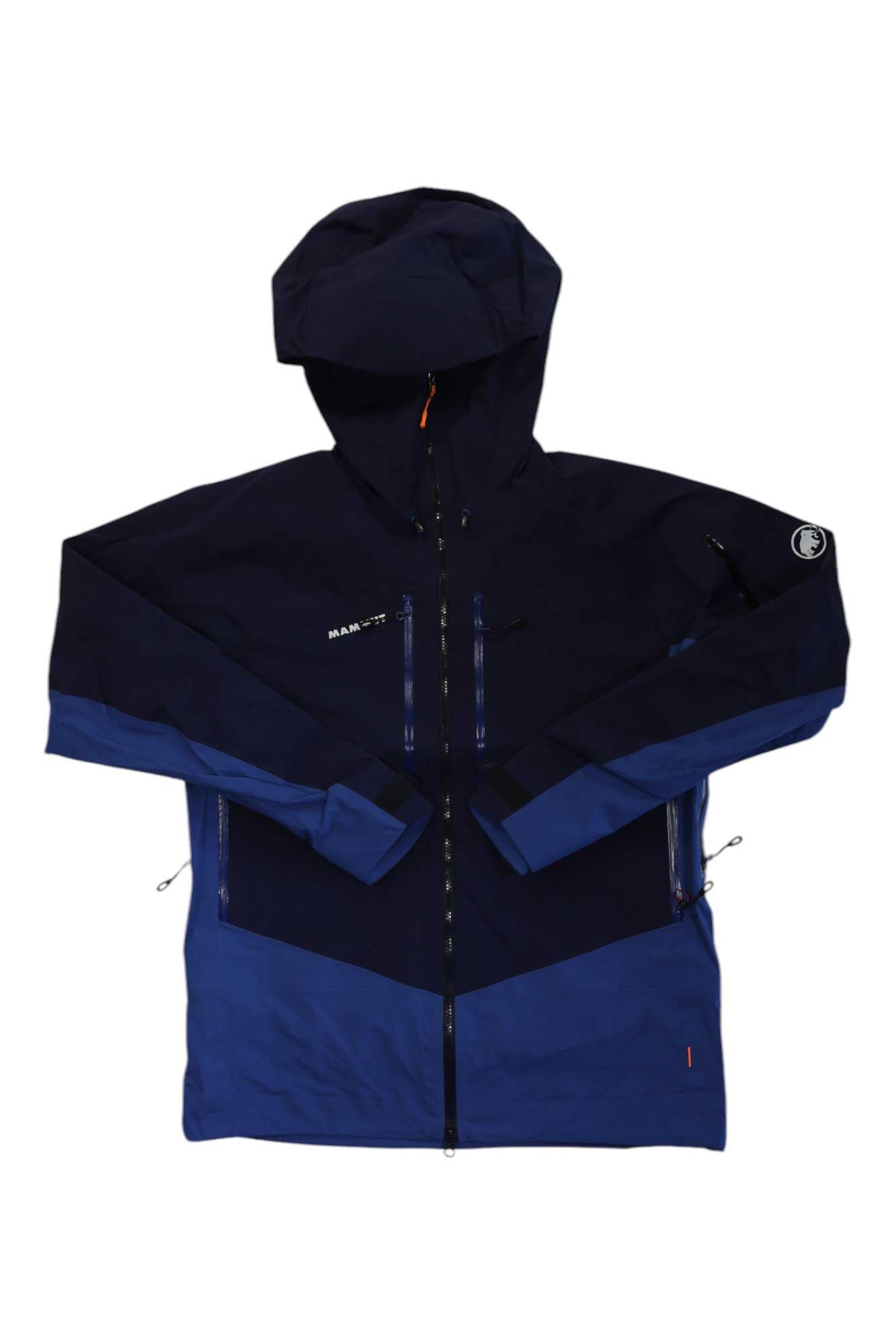 The Mammut Mens Taiss Pro HS Hooded Jacket is a navy blue alpine jacket with a front zipper, two chest pockets, lighter blue sleeve and lower accents, and subtle logo details on the upper left chest and sleeve.