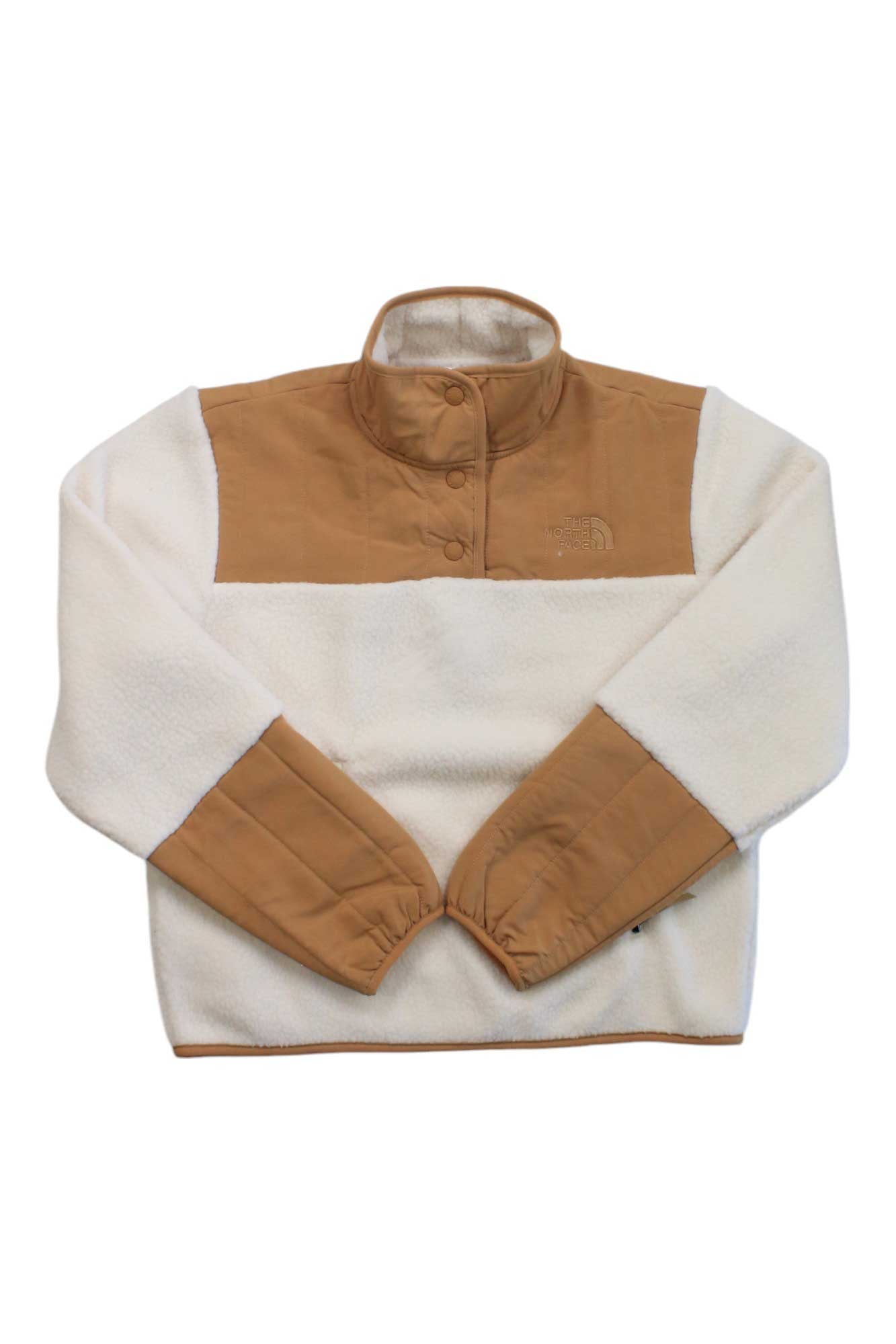 The North Face Womens Cragmont Fleece 1/4 Snap Top features a high collar, tan chest and sleeve accents, cream recycled polyester fabric, neck snaps, and elastic cuffs for comfort.