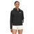 A woman stands facing forward, wearing The North Face Womens Hanging Lake Jacket—a black waterproof jacket with a DryVent 2L shell—and light-colored shorts against a plain white background.