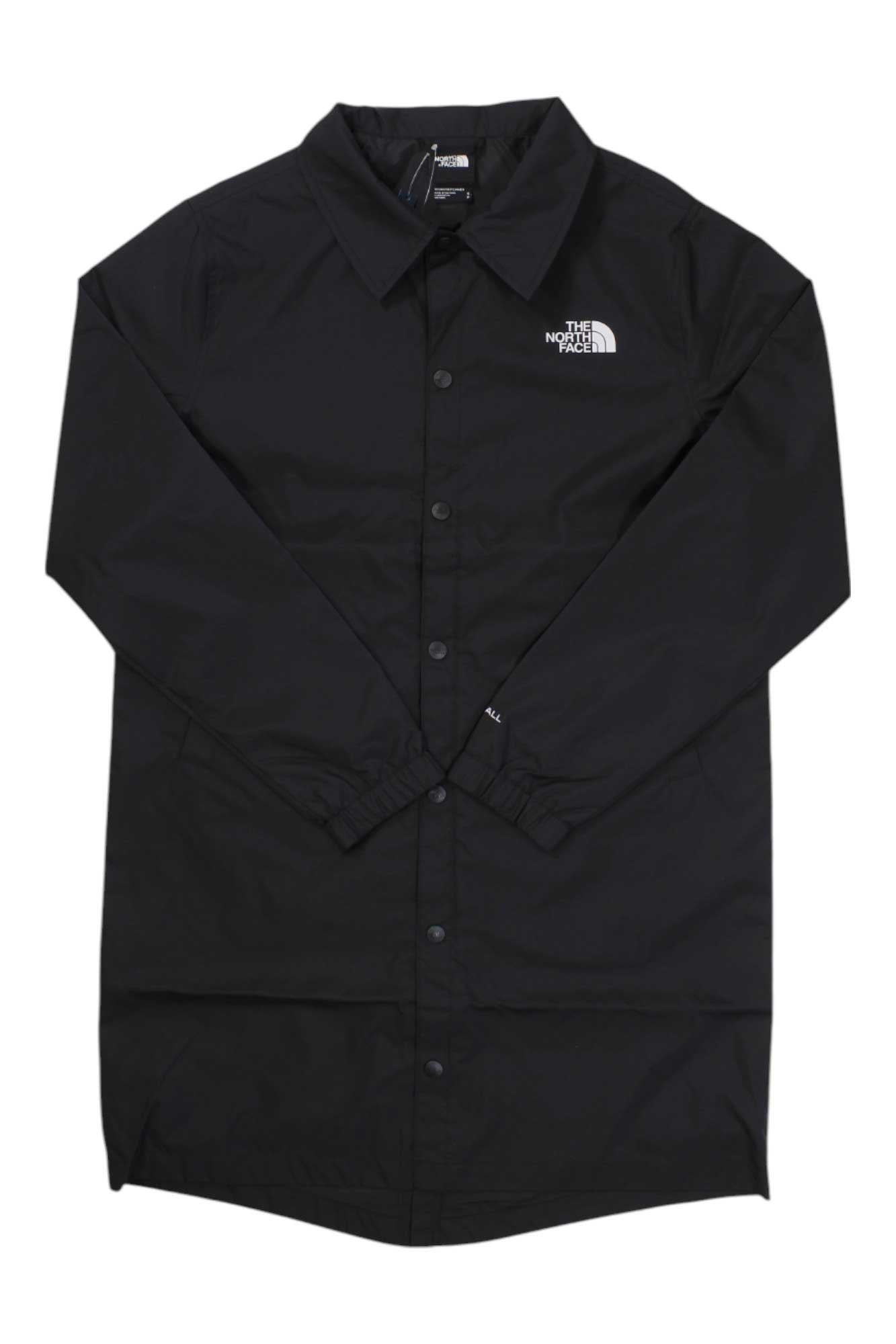 The North Face Women's IC Coaches Jacket is a long-sleeve, black button-up with the brand’s white logo on the left chest, shown laid flat against a white background.