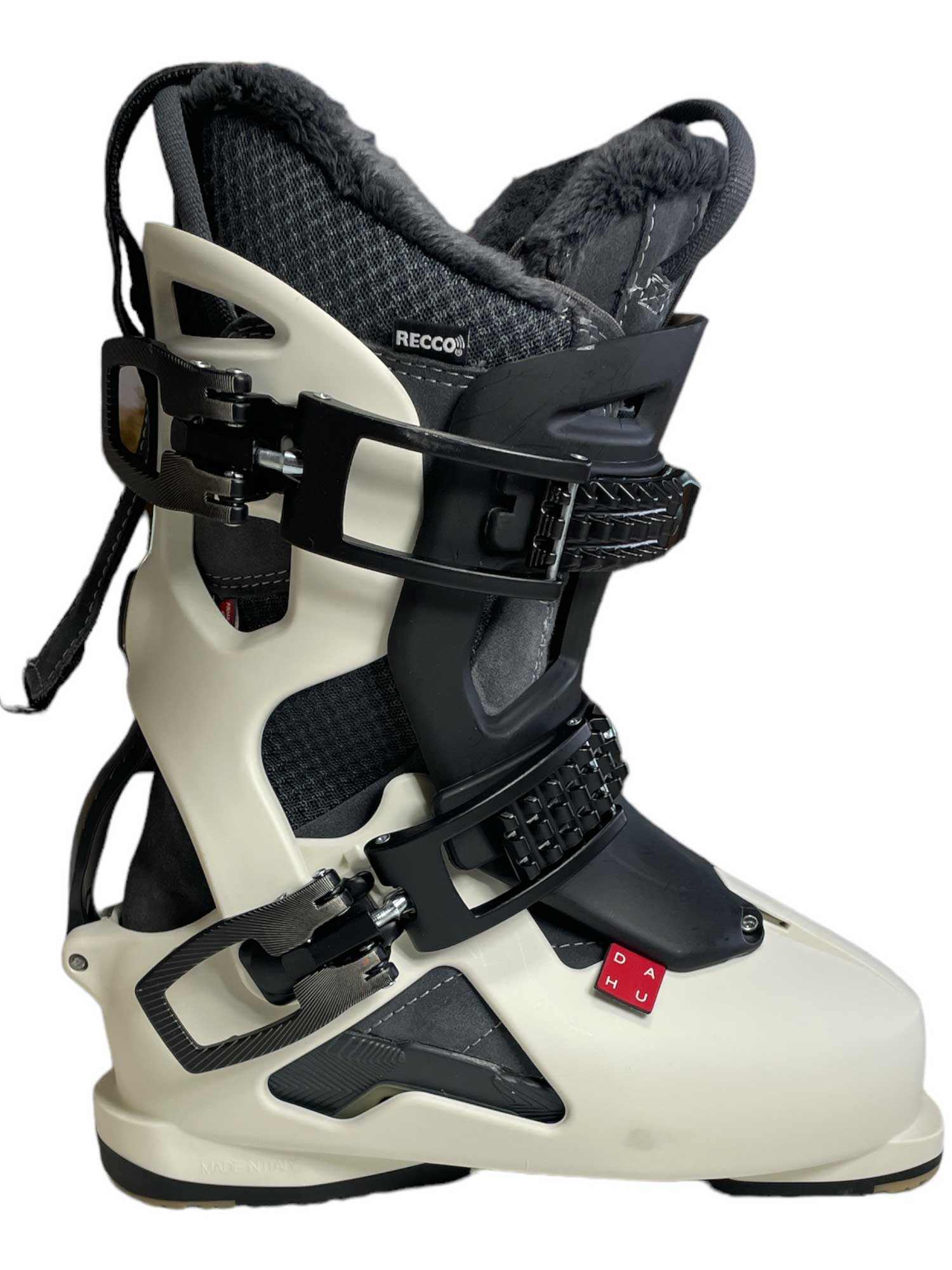 The Dahu Womens Ecorce 01 W110 Flex Ski Boot is a white and black all-mountain ski boot for women, featuring adjustable buckles, Primaloft insulation, padded lining, and a RECCO reflector label, shown on a plain white background.