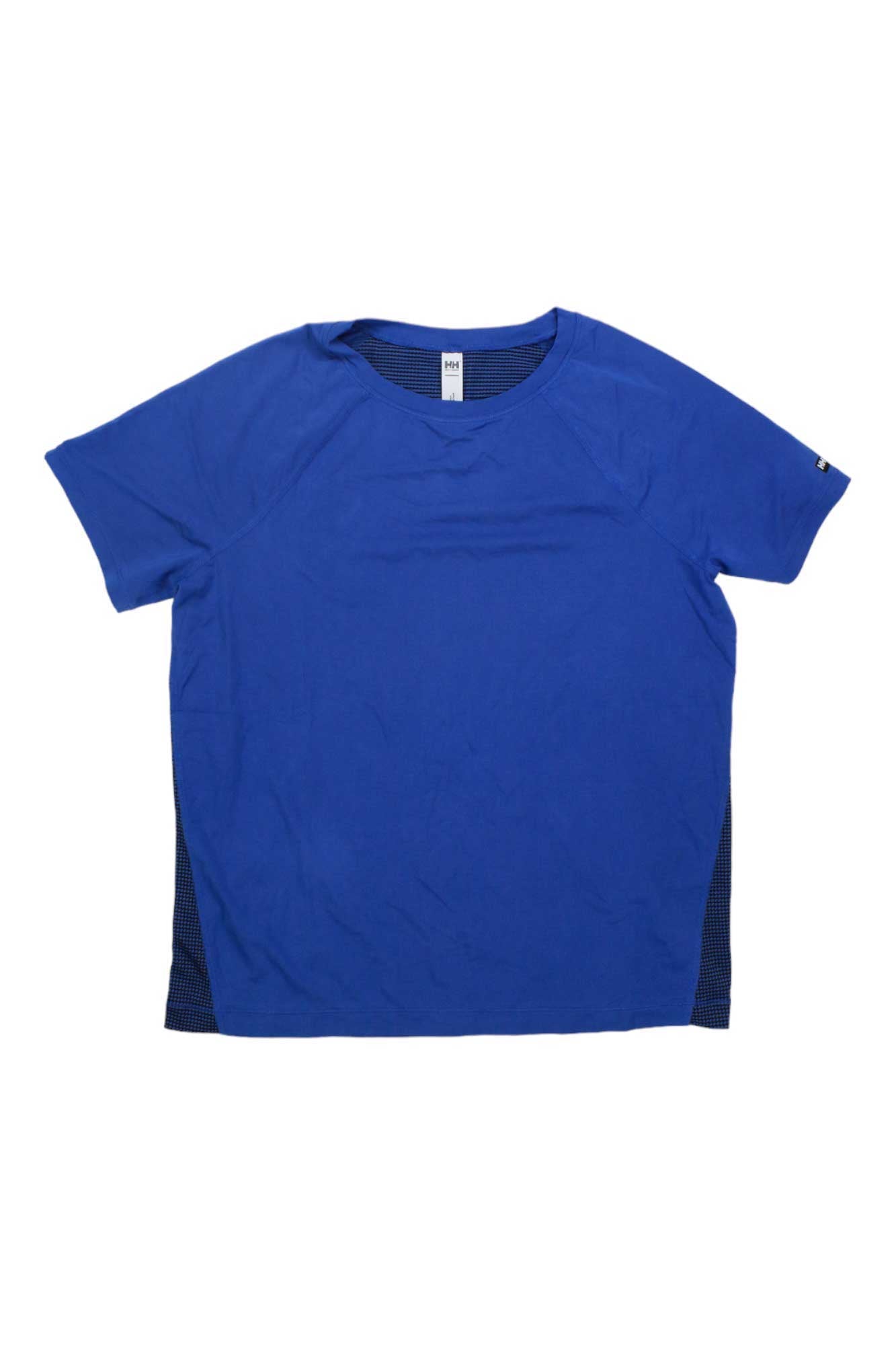 The Helly Hansen Womens Tech Trail SS T-Shirt is a plain blue tee with a round neckline, subtle side mesh panels for breathability, and lightweight stretch fabric, shown laid flat on a white background.