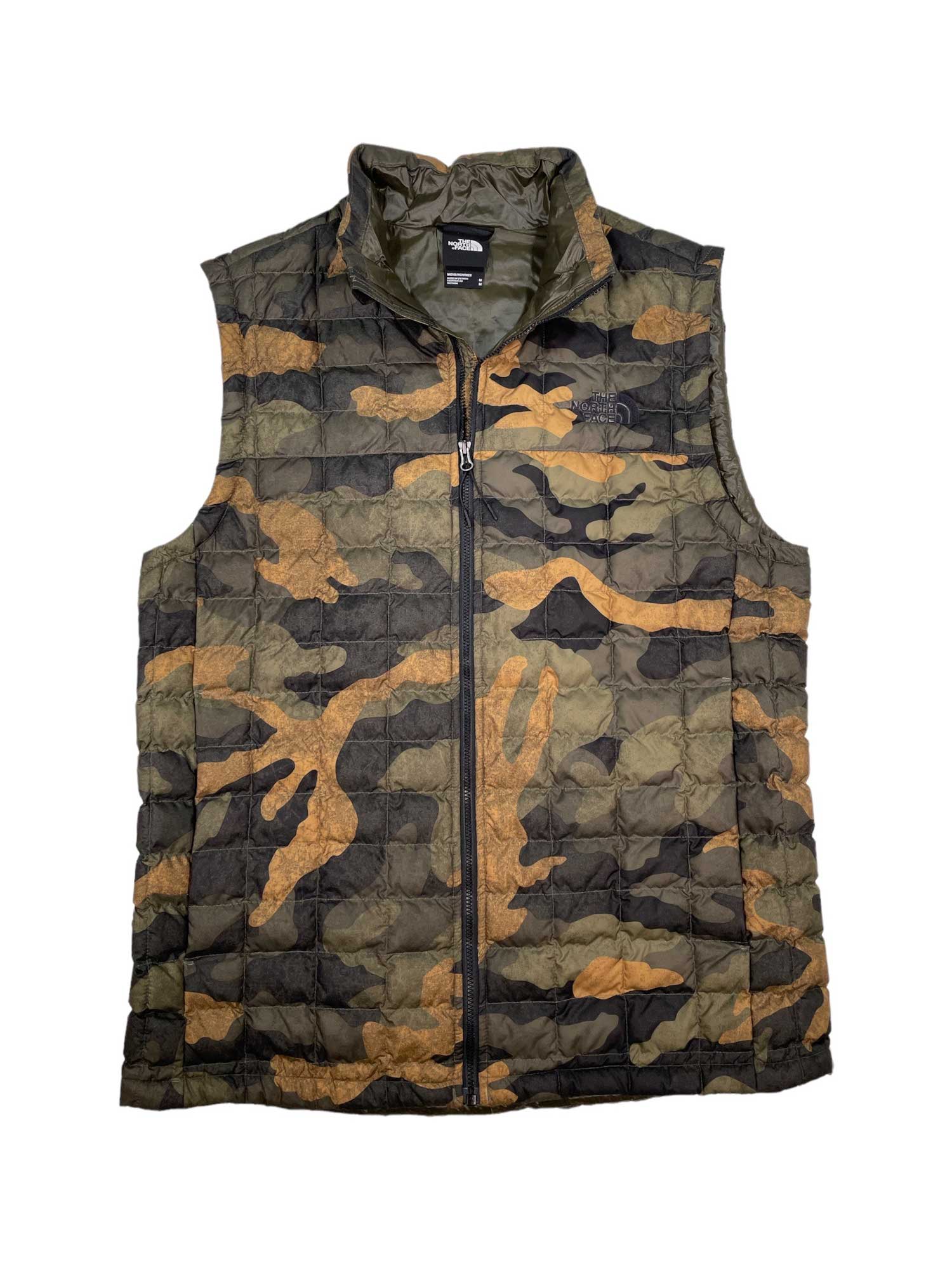 The Mens ThermoBall Eco Insulated Vest is a lightweight, sleeveless vest with green, brown, and black camo print, featuring a front zipper and high collar—ideal for outdoor adventures.