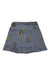 The Toad & Co Women's Chaka Ruffle Skirt is a gray A-line skirt with brown and yellow floral print and a ruffled hem, made from organic cotton. It’s shown spread flat on a white background.