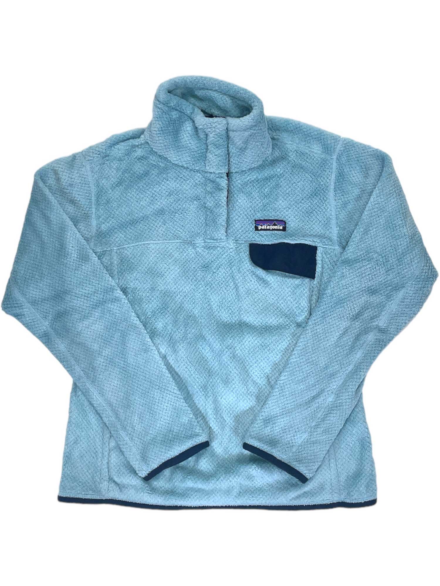 Women's Re-Tool Snap-T Pullover: Light blue Polartec Thermal Pro fleece with high collar, dark blue-accented chest pocket, and small rectangular Patagonia logo above the pocket. This textured layer is Fair Trade Certified.