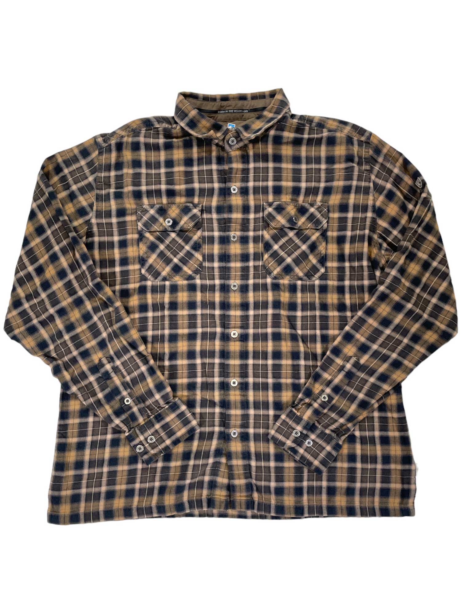 The Kuhl Mens Dillingr Flannel Shirt is a long-sleeved, button-up flannel with yellow and black plaid, front chest pockets, and buttoned cuffs—ideal as an outdoor shirt.