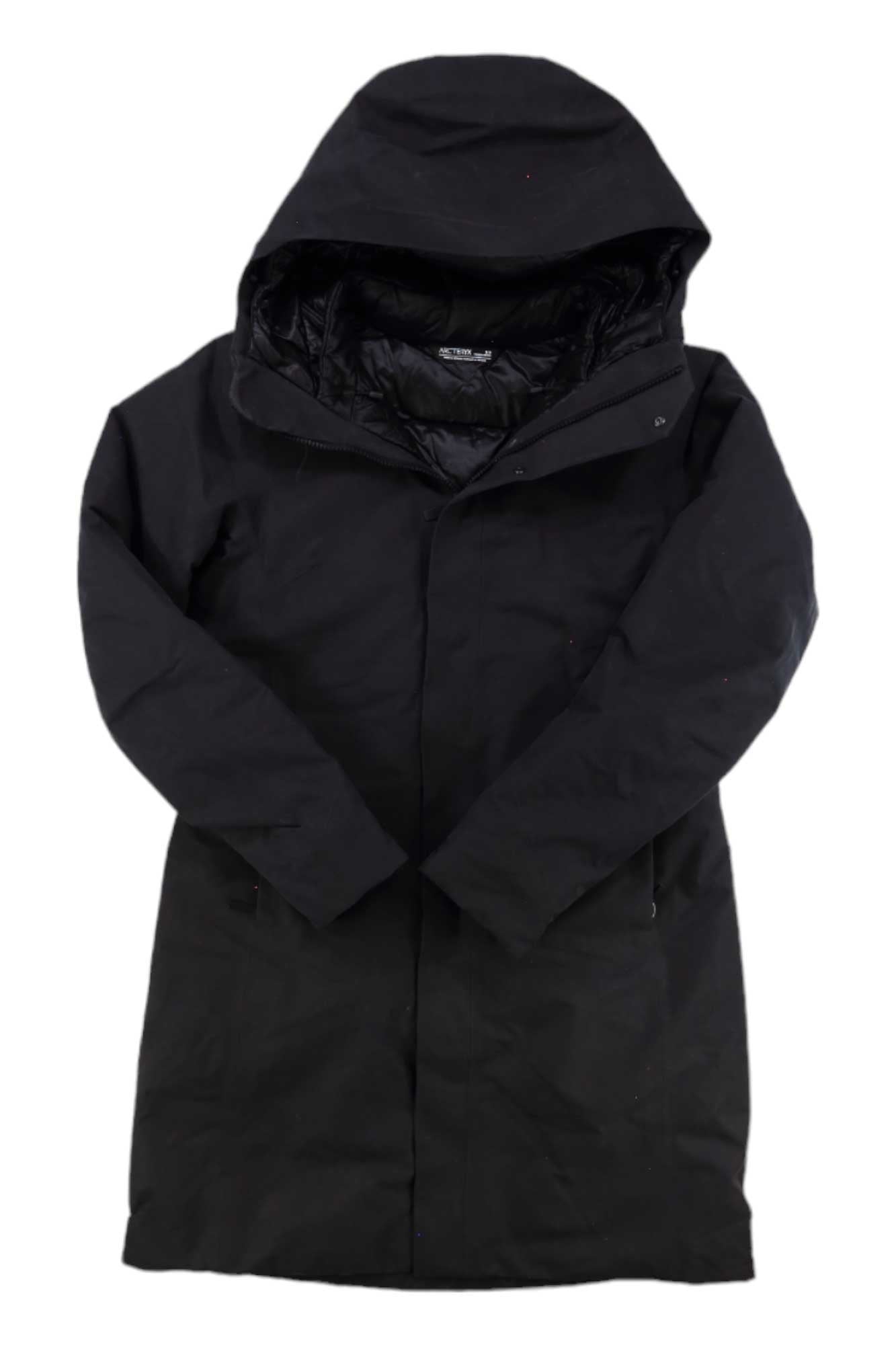 The Arcteryx Womens Patera Parka is a long black hooded winter coat with front zipper and snap closure, shown flat on a white background. This insulated, padded parka features a high collar for warmth and waterproof protection.