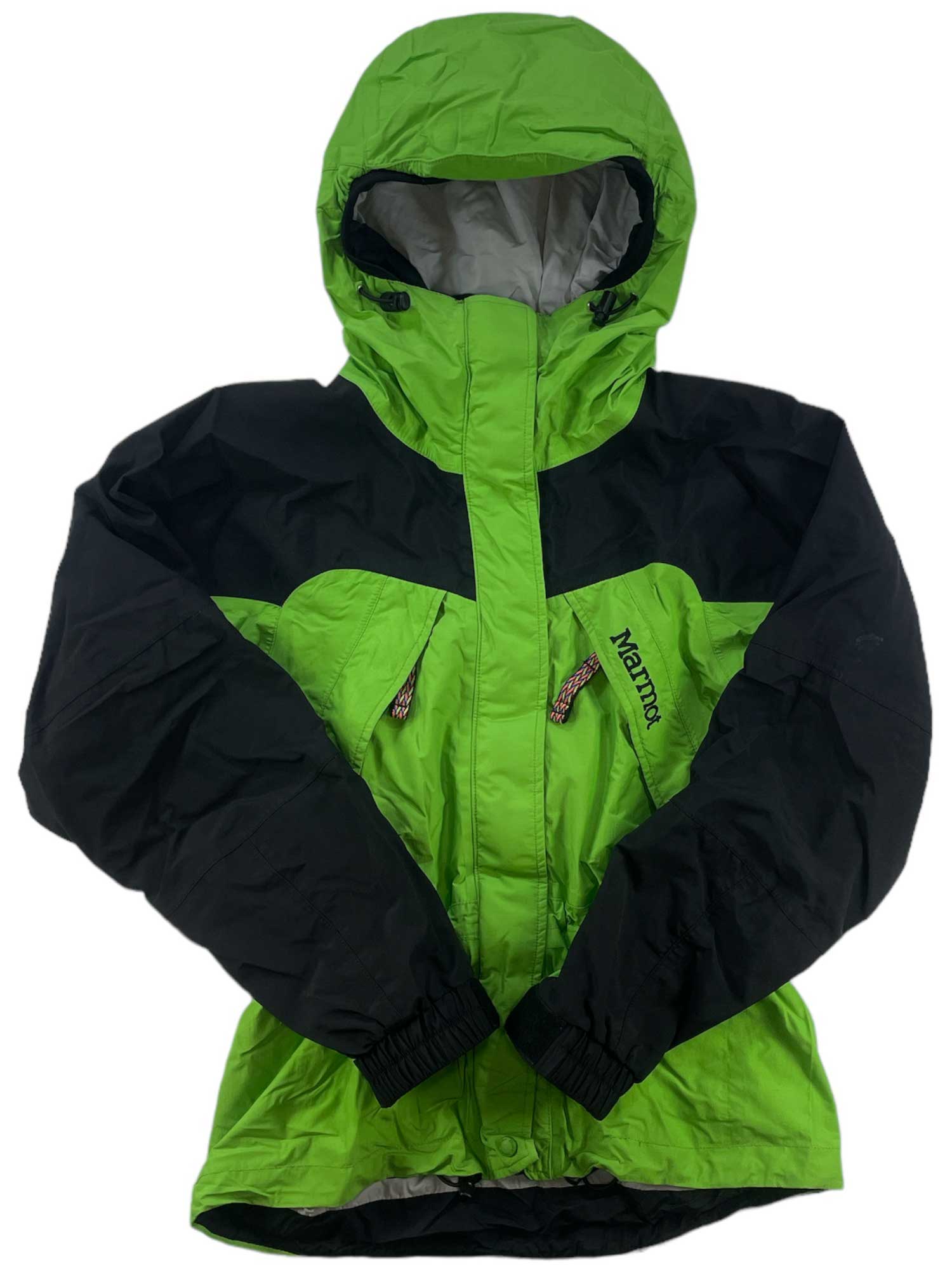 The Womens Gore-Tex Shell Jacket in green and black features a front zipper, zippered chest pockets, and elastic cuffs—perfect as a waterproof winter hiking jacket for women.