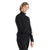 A person with short, light brown hair wears the Icebreaker Womens ZoneKnit LS Half Zip Top in black and black pants, standing against a plain white background with one arm crossed over their body.