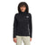A woman with curly hair smiles while standing against a white background, wearing the black The North Face Womens Canyonlands 1/4 Zip Top and light-colored pants.
