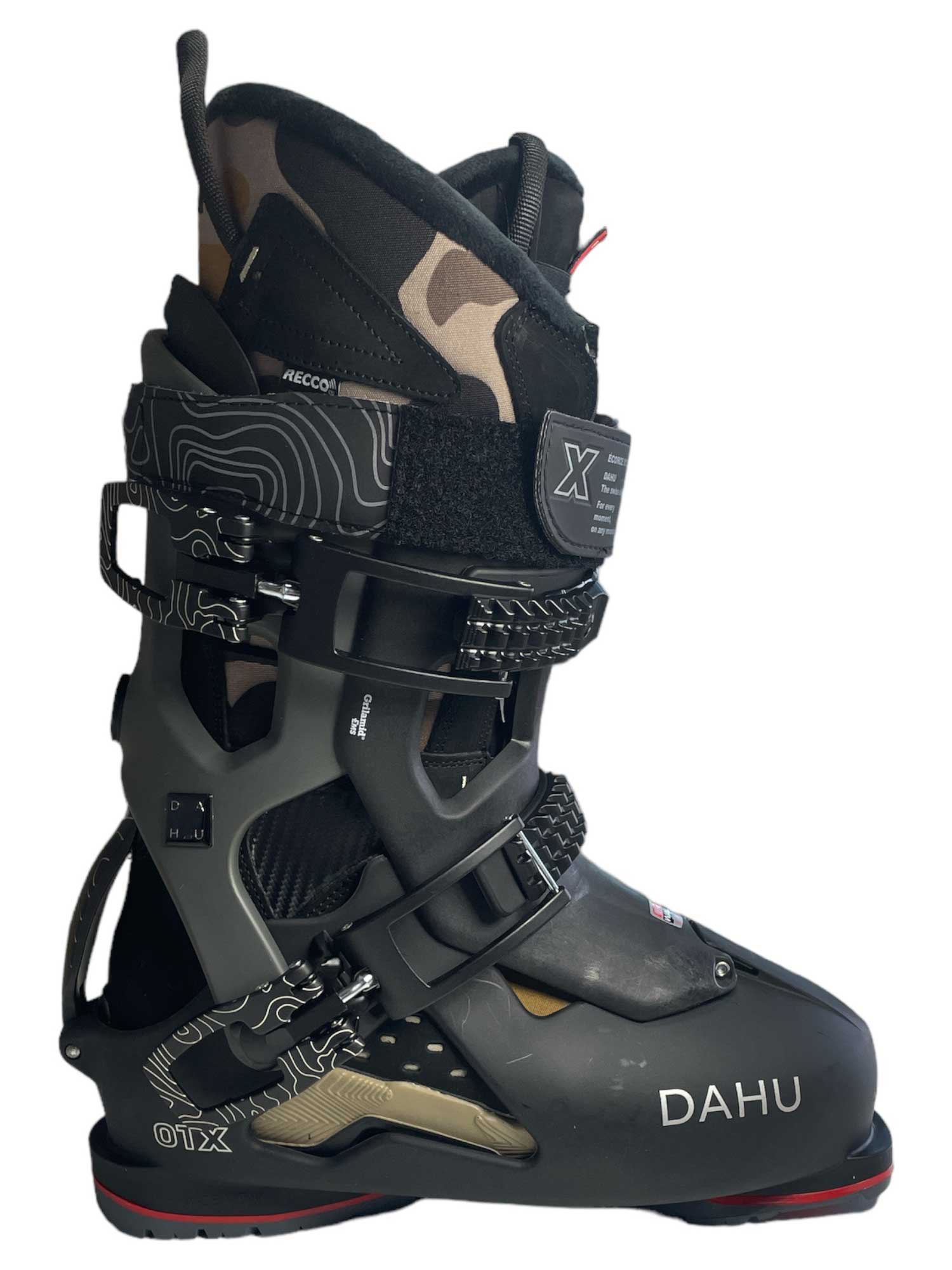 The Dahu Men's Ecorce 01 X Limited Edition M135 Flex Ski Boot in black features multiple buckles, Velcro straps, and a Primaloft-insulated patterned liner—ideal for all-mountain skiers. Shown in side profile against a white background.