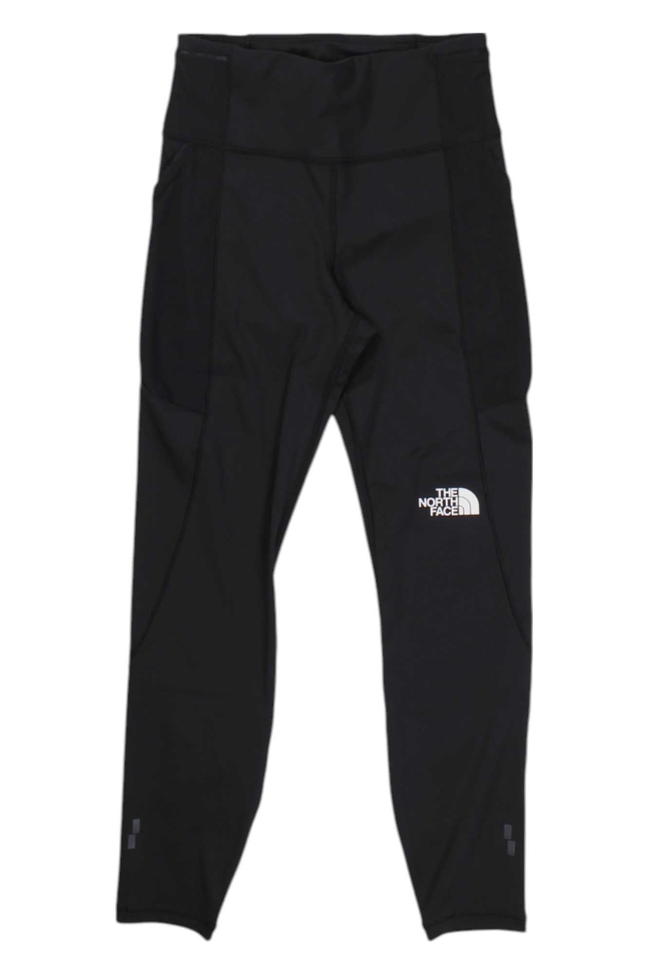 The North Face Womens Movmynt 7/8 Tight, featuring a high waistband, white logo on the left thigh, and made from moisture-wicking material, is shown against a white background.