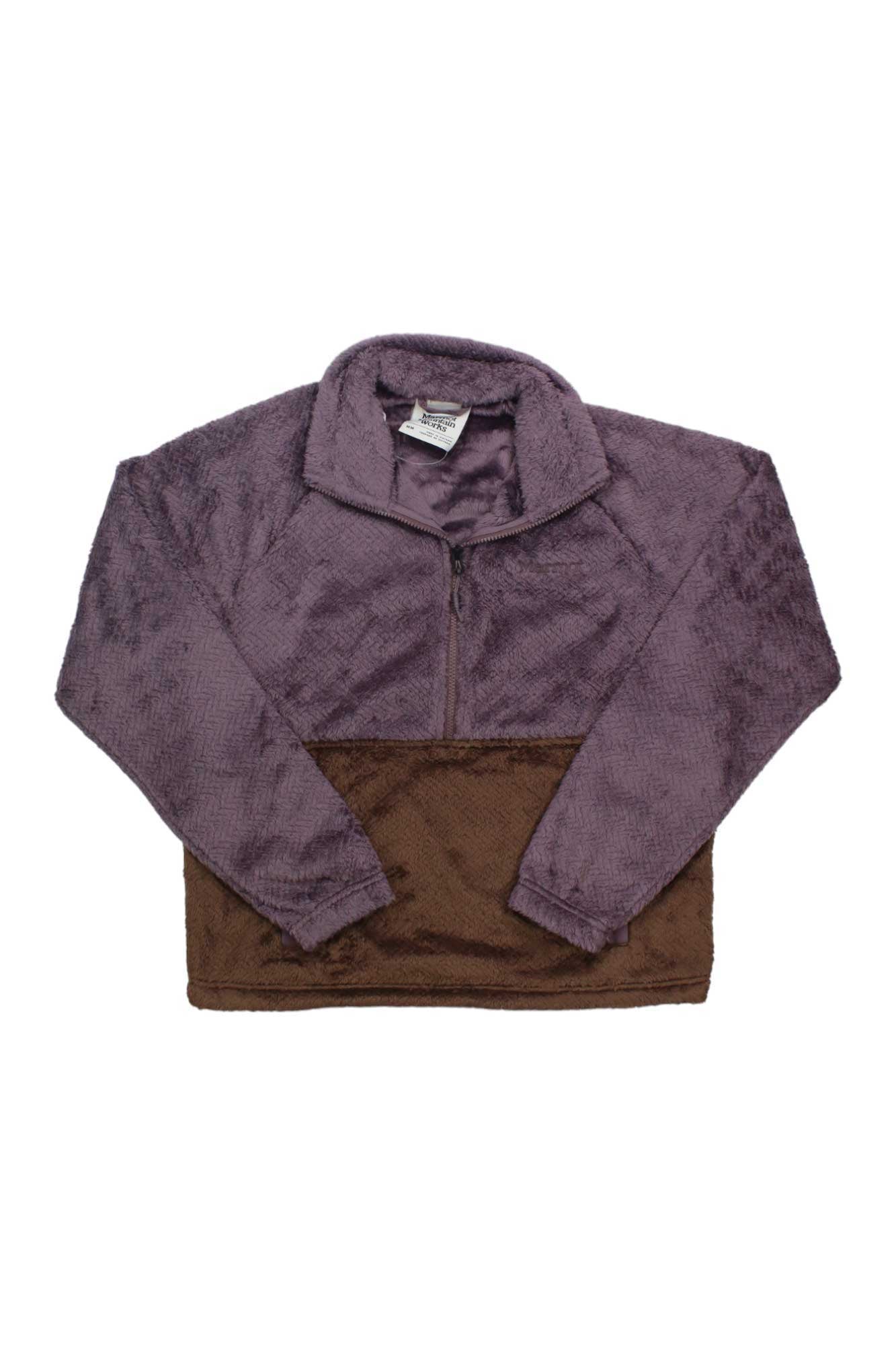 The Womens Homestead Sherpa 1/2-Zip Fleece is a long-sleeve, fuzzy pullover with a purple upper and brown lower section, shown laid flat on white—ideal as your cozy outdoor layer.