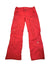 The Womens Steep Series HyVent Snow Pants are bright red, made with waterproof HyVent Alpha 2L fabric. They feature zippered pockets, belt loops, visible stitching, and North Face and Steep Tech logos on the thighs.
