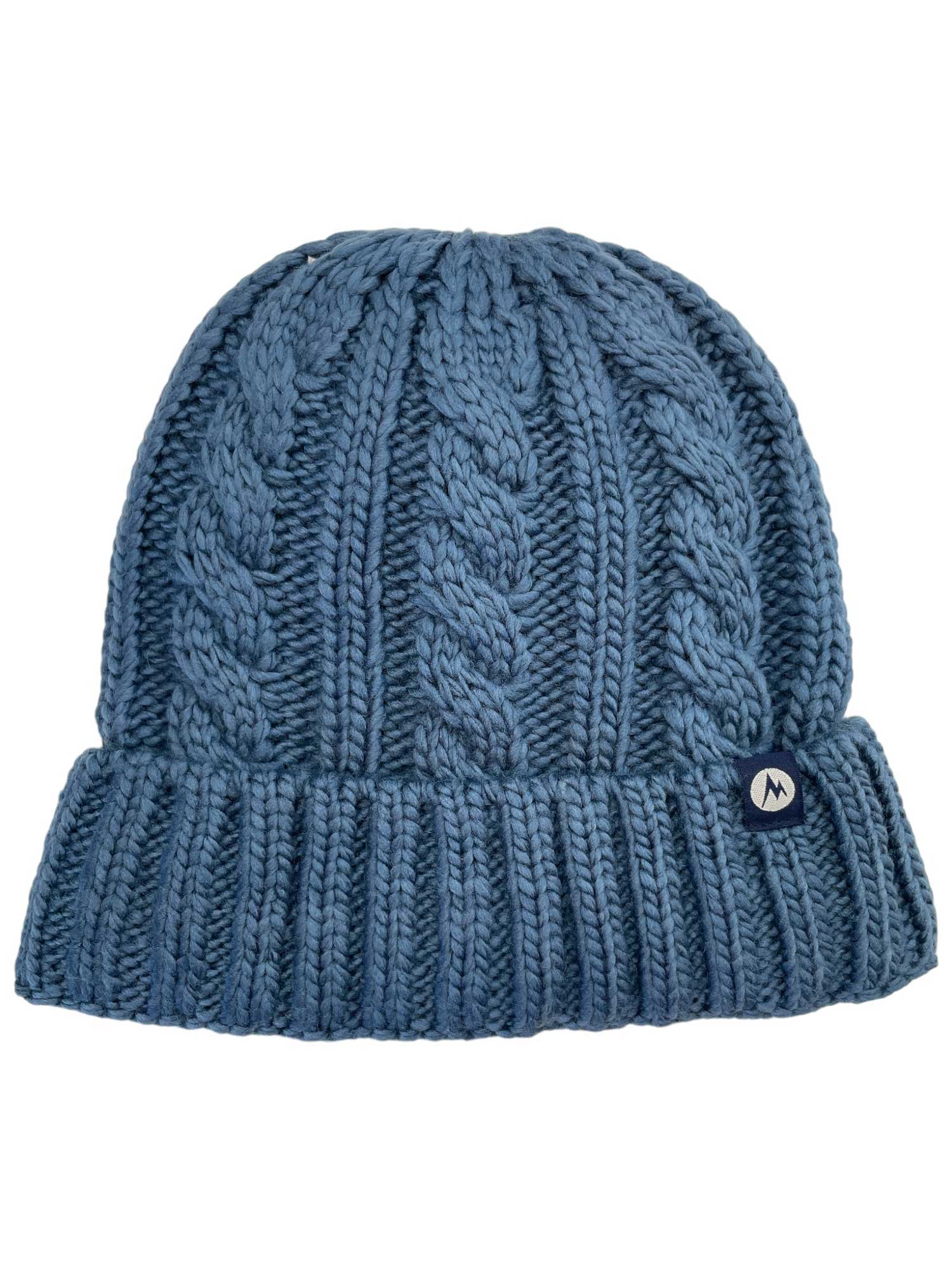 The Marmot Women's Millberry Hat is a chunky blue knit hat with a fold-over brim, cable knit pattern, and small round black-and-white logo tag—made from recycled polyester for cozy, eco-friendly style.