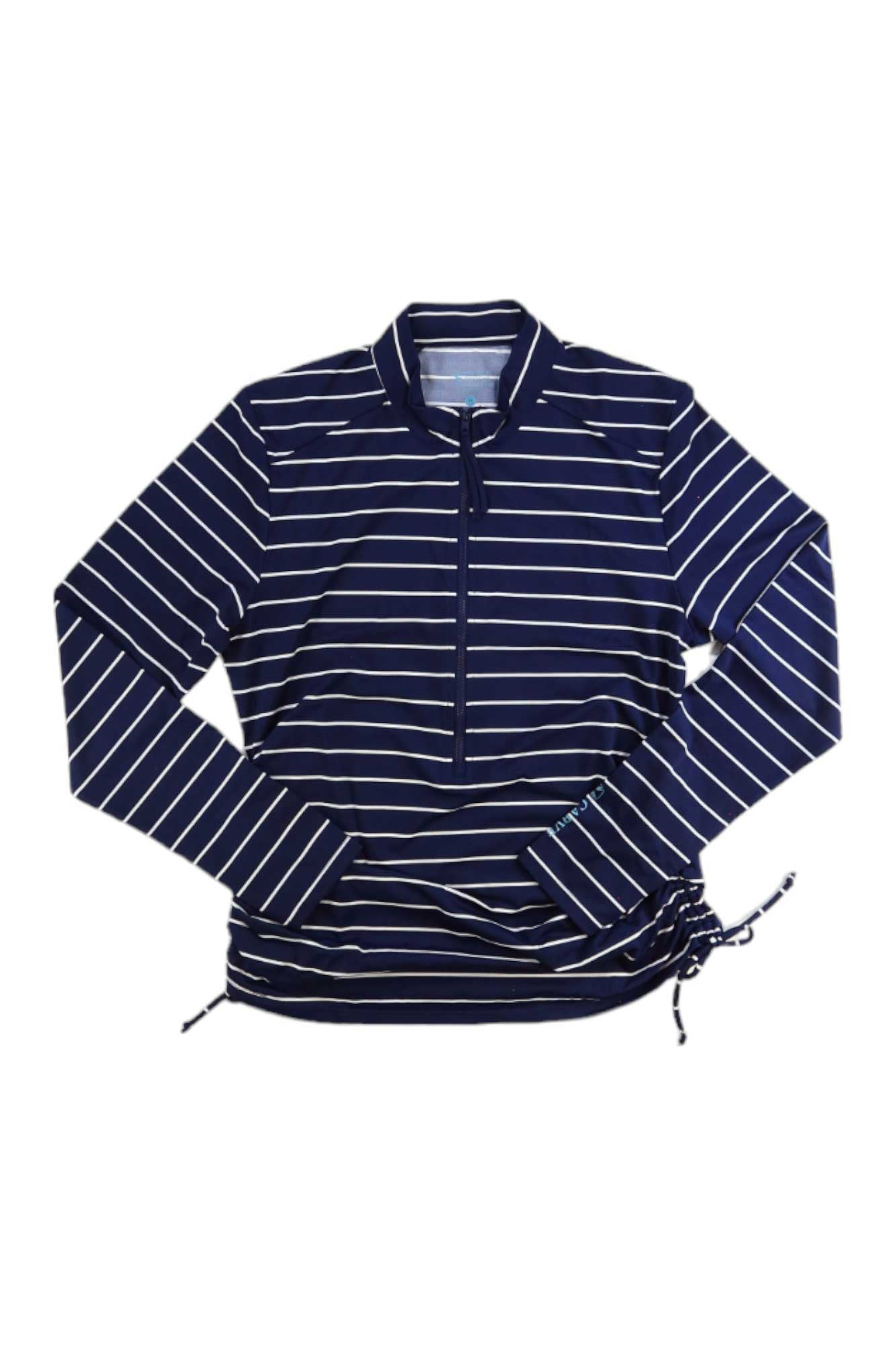 The Carve Designs Women's Cruz Rash Guard is a navy blue, long-sleeve swim shirt with white stripes, UPF 50+ protection, a quarter-zip front, and adjustable side ties at the hem.