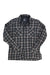 The Kuhl Mens Dillingr Flannel Shirt is a long-sleeve, button-up men’s shirt in black, gray, and white plaid with two chest pockets, shown laid flat on a white background.
