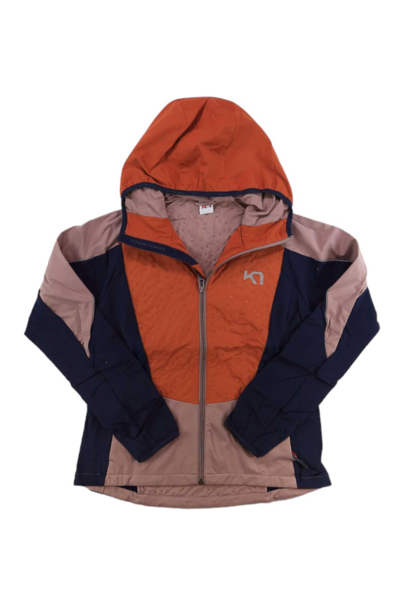 The Kari Traa Womens Tirill 2.0 Jacket is made from recycled polyester and features a color-blocked hood, front zipper, orange, light pink, and dark navy blue panels, plus a small white chest logo.
