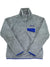 The Women's Re-Tool Snap-T Pullover is a gray Polartec Thermal Pro fleece with a quarter-zip collar, blue trim on the hem and cuffs, and a blue chest pocket topped with a logo patch.