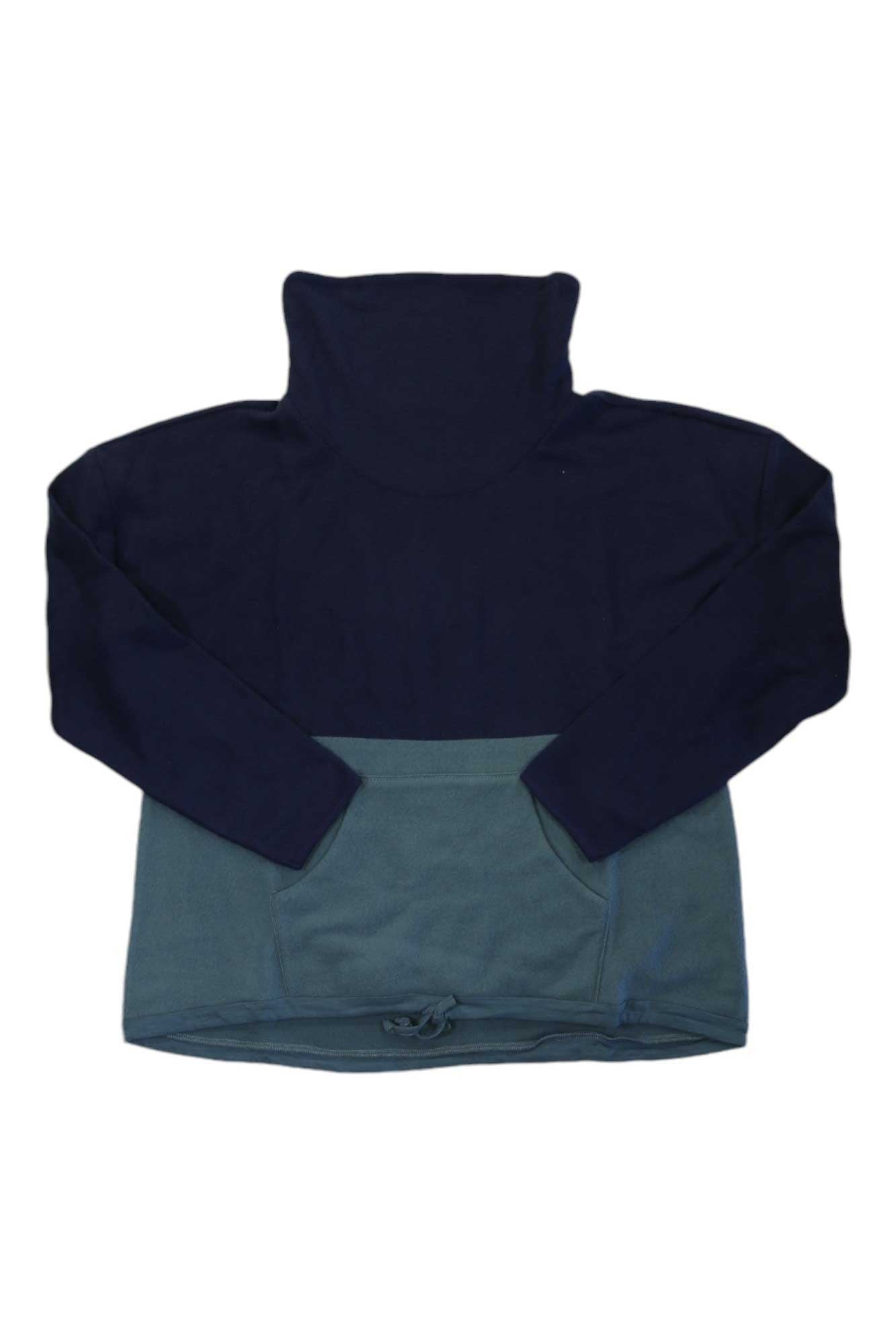 The Carve Designs Womens Rowayton Colorblock Cowl Neck is a long-sleeve pullover with a high turtleneck, navy blue upper and sleeves, muted green lower half, and front pocket—ideal as a relaxed fit travel shirt for women.