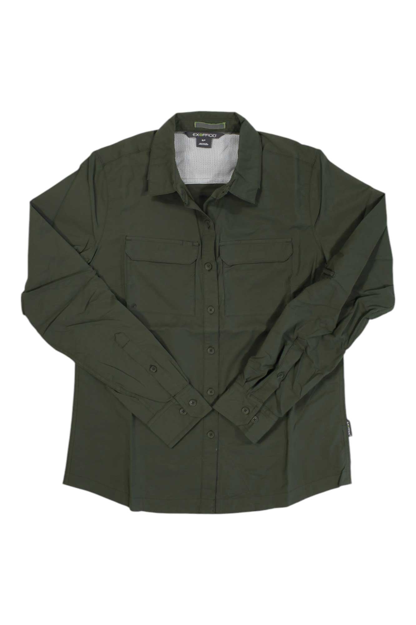The ExOfficio Womens Missoula LS Shirt is a dark green, long sleeve hiking shirt with two chest pockets, shown laid flat on a white background. This moisture-wicking shirt is ideal for outdoor adventures.