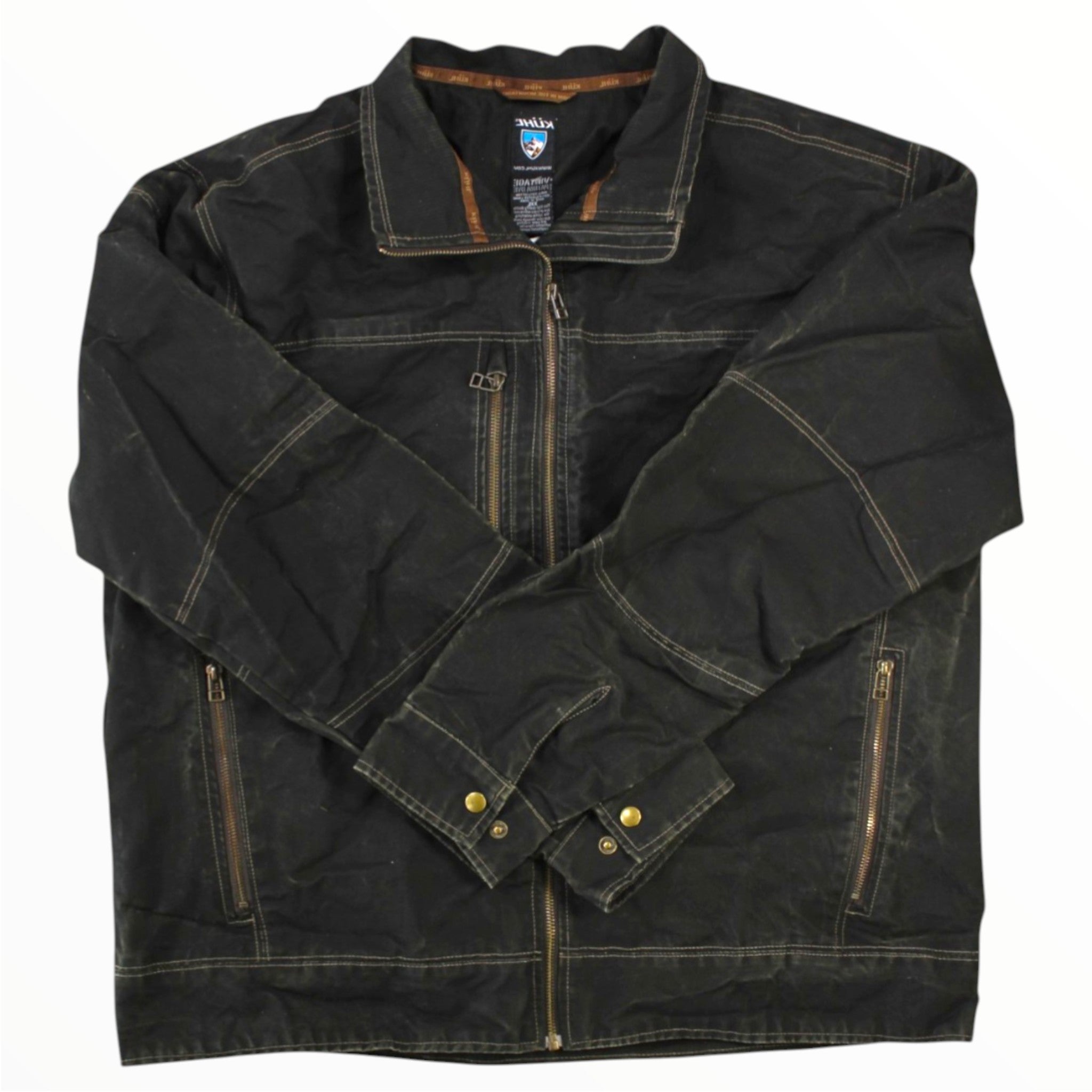 The black Kuhl Mens Canvas Full Zip Jacket features brown stitching, a zip front, two side pockets, and buttoned cuffs. Shown flat on a white background with sleeves crossed over the chest.