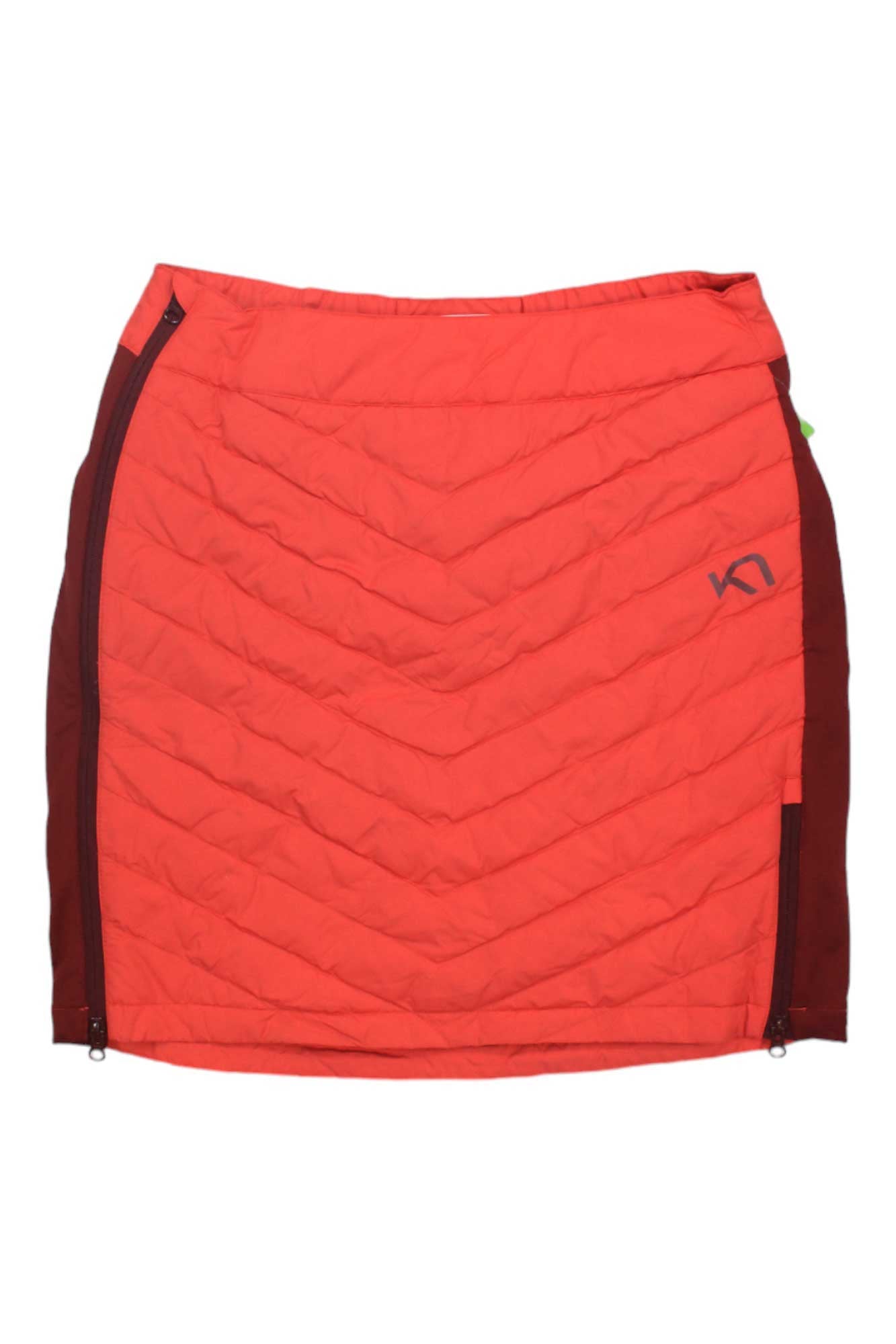 The Kari Traa Women's Eva Skirt is a bright orange down skirt with maroon side panels, side zippers, and a small front left logo—perfect as a cozy hiking skirt.