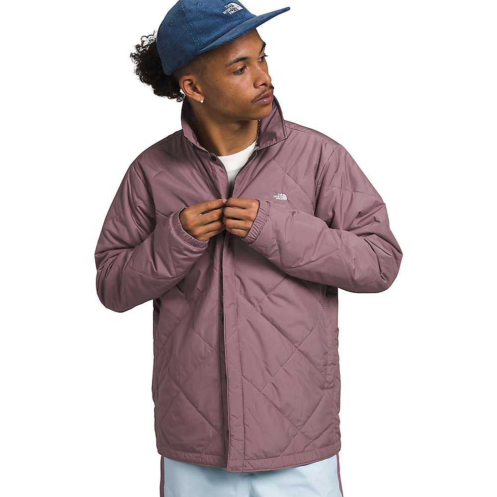 Men's quilted insulated jacket with front zipper, stand collar, and chest logo