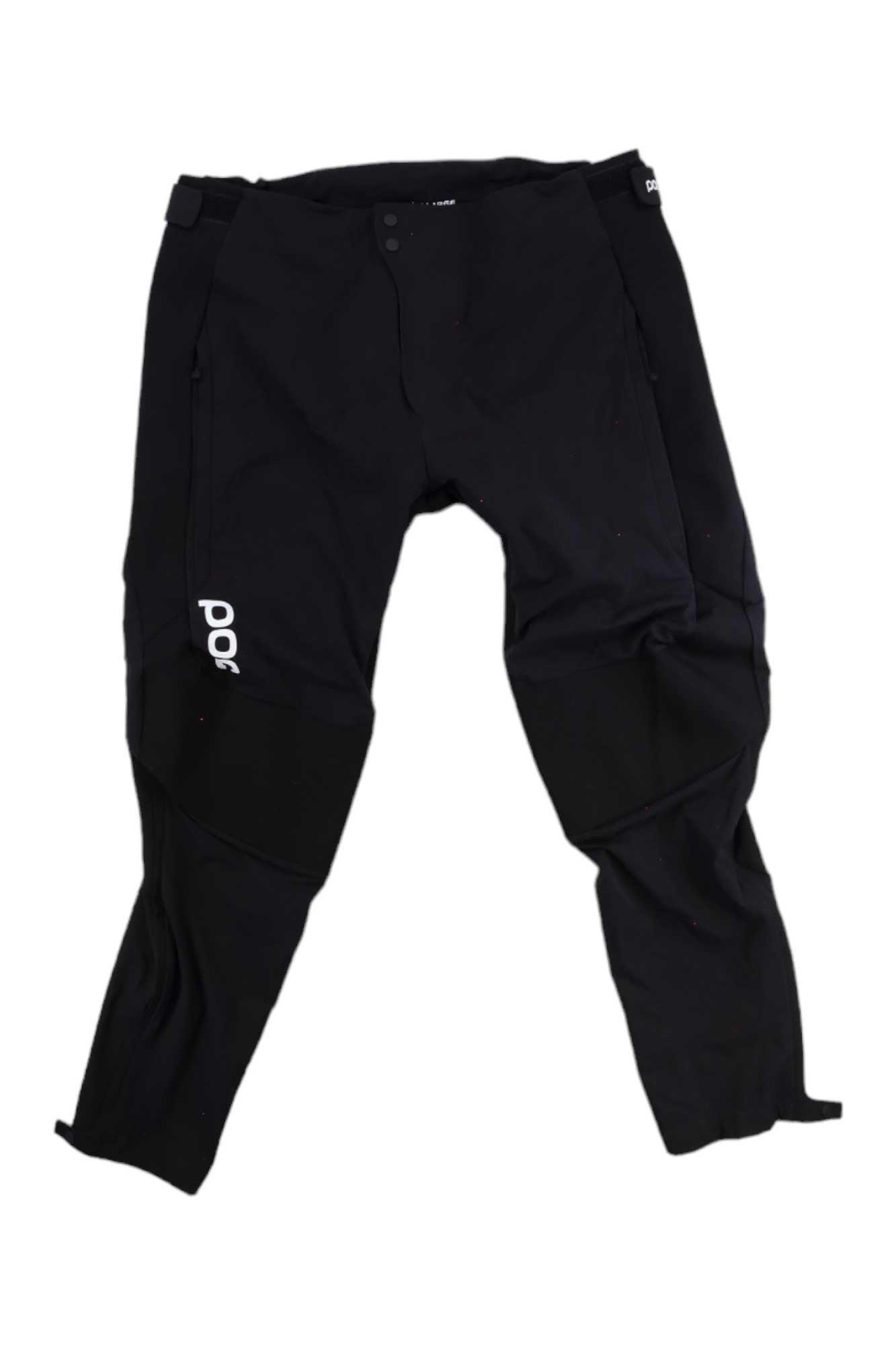 The POC Sports Mens Resistance Pro DH Pant are black slim-fit athletic pants with white POC logo on the left thigh, zipper pockets, and reinforced knee panels—ideal for mountain biking. Shown laid flat on a white background.