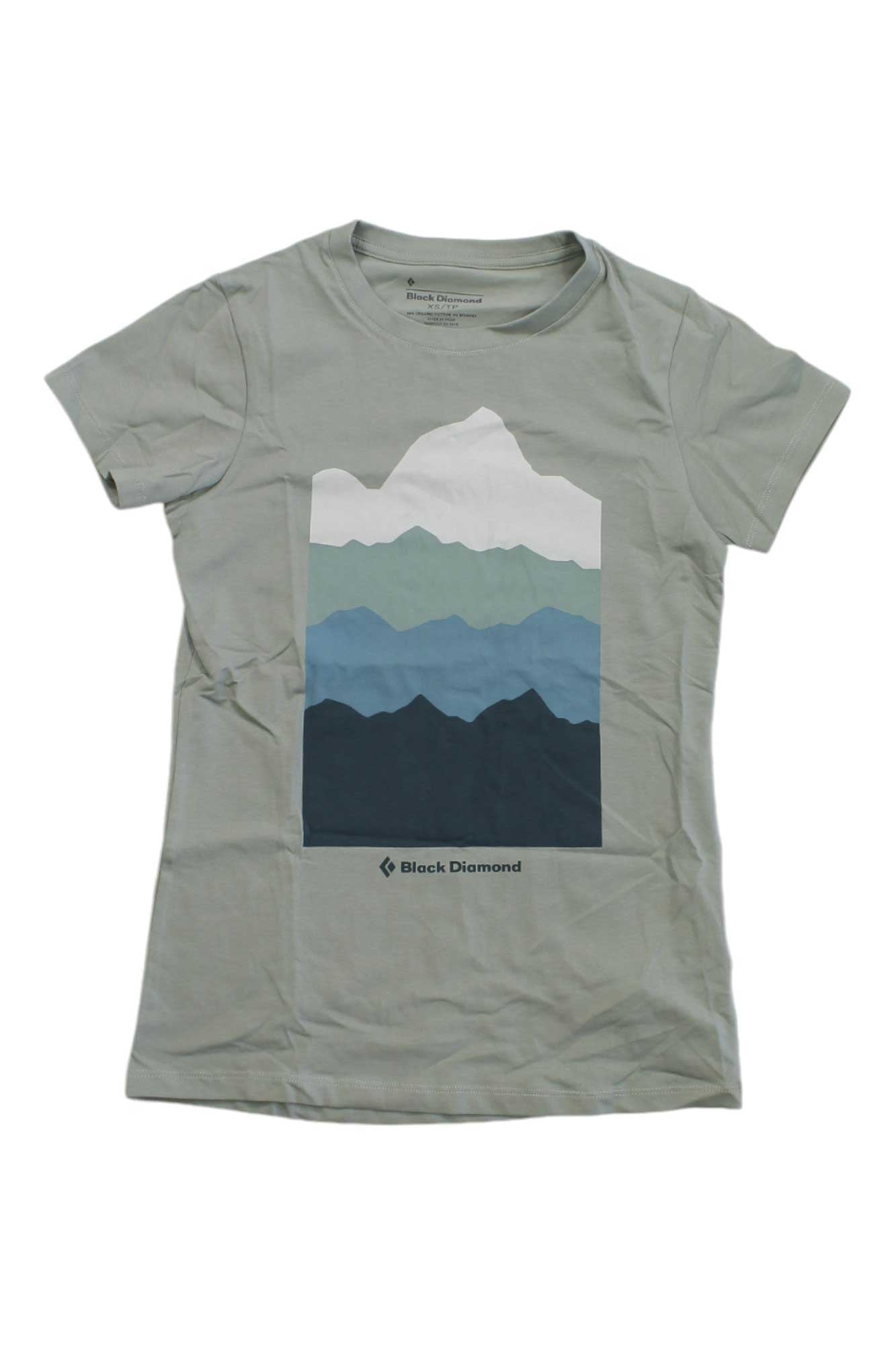 The Black Diamond Womens Vista Tee is a light gray short-sleeve shirt made of soft organic cotton, featuring a blue and green stylized mountain graphic with the Black Diamond logo and name below the design.