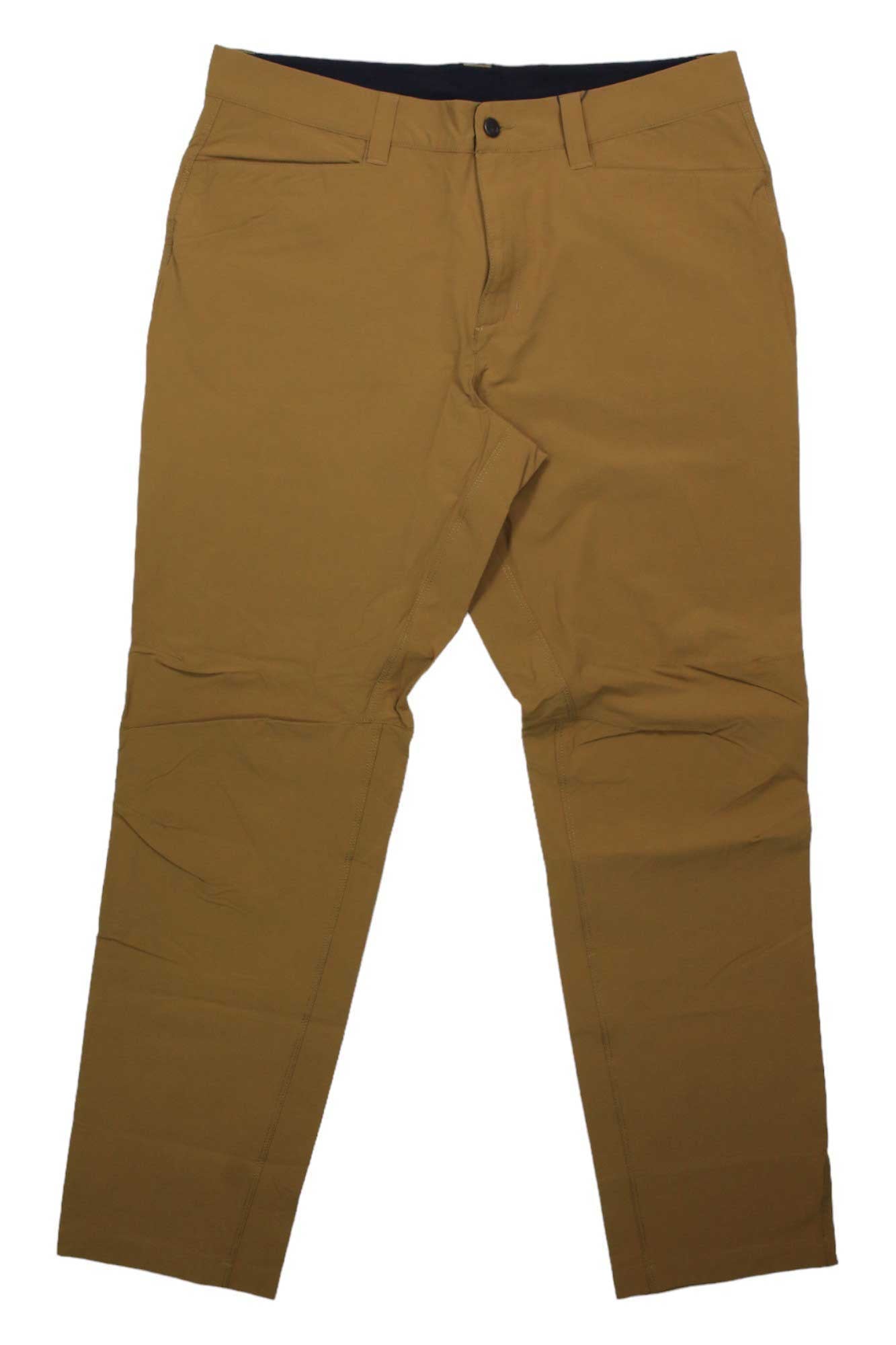 A pair of tan Rab Men's Capstone Pants, straight-cut and made from stretch nylon with a button closure and side pockets, is laid flat on a white background.