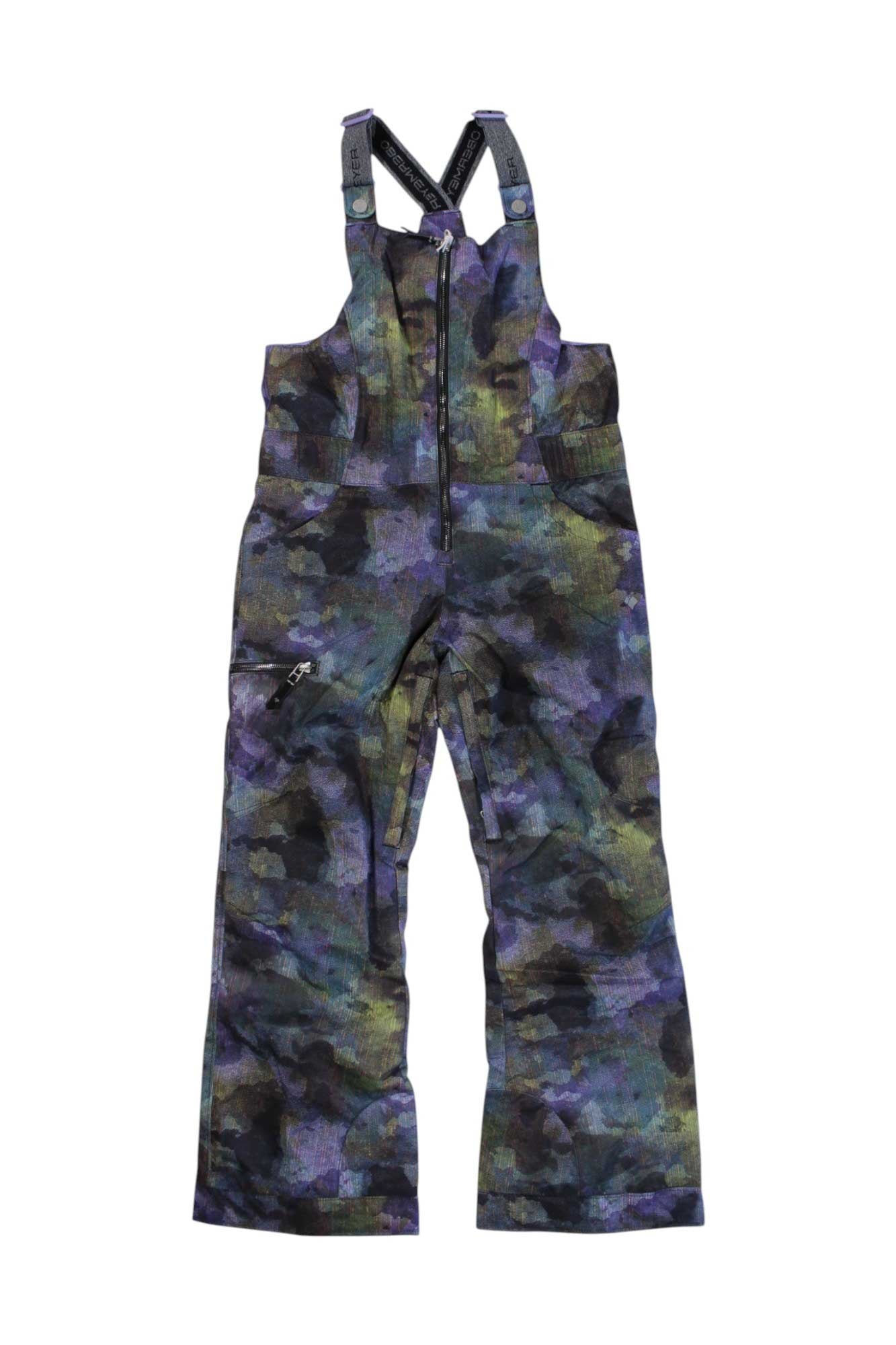 The Obermeyer Girls Anya Bib Pant features green, blue, and purple camouflage, adjustable black straps, and a front zipper—perfect as girls' snow pants or youth ski outerwear for winter fun.