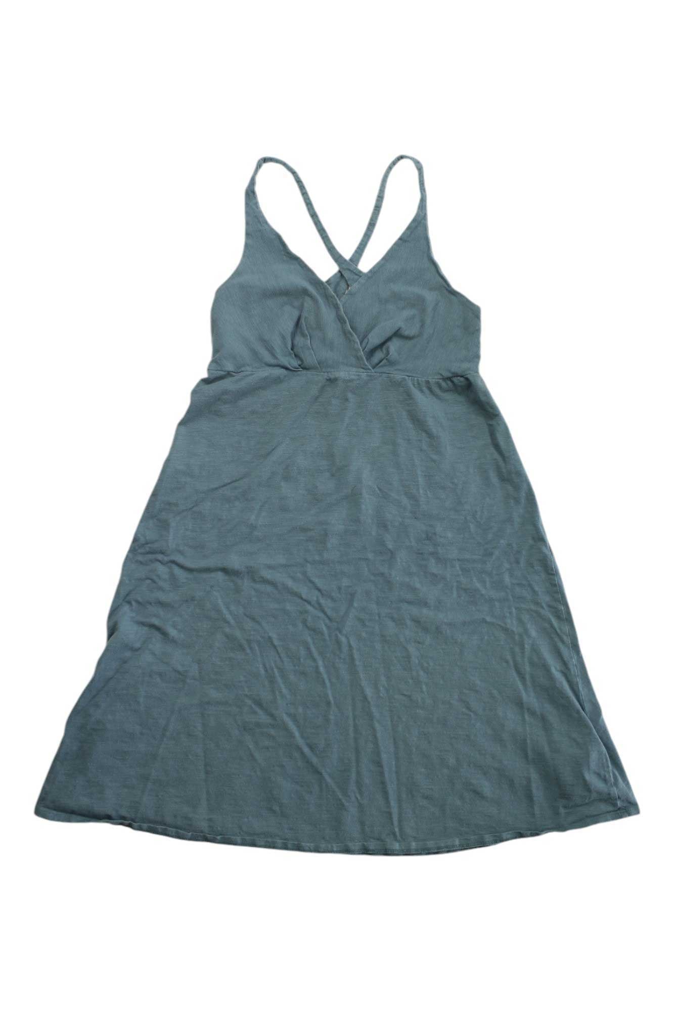 A sleeveless, knee-length Womens Amber Dawn Dress by Patagonia in muted blue, featuring a V-neck and crossed back straps, shown flat on white—a stylish, sustainable fashion option.