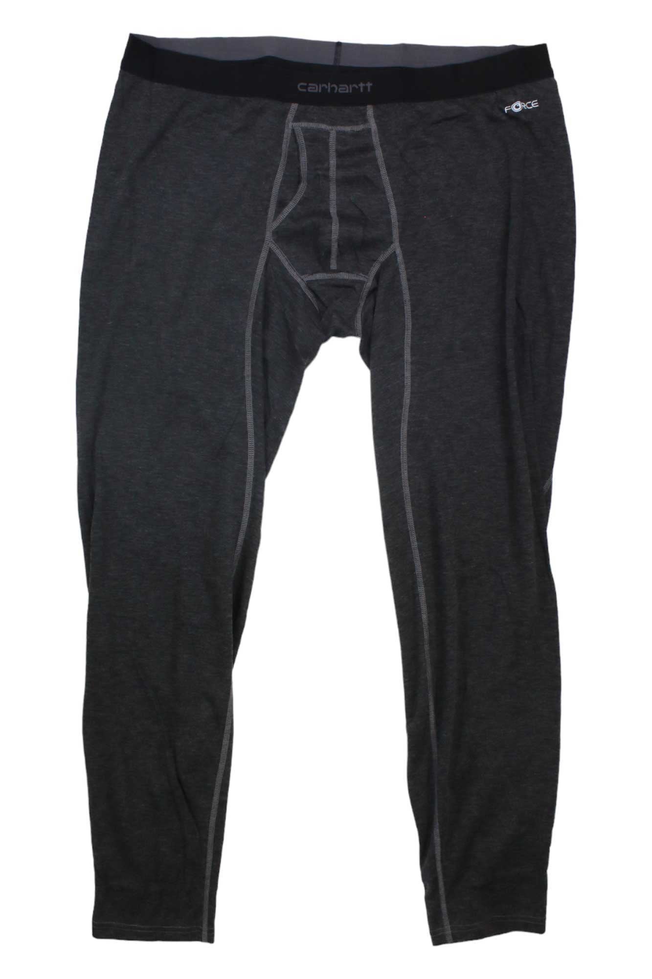 A pair of Carhartt Men's Base Force Heavyweight Poly-Wool Bottom leggings in dark gray, featuring visible stitching and an elastic waistband, are laid flat on a white background.