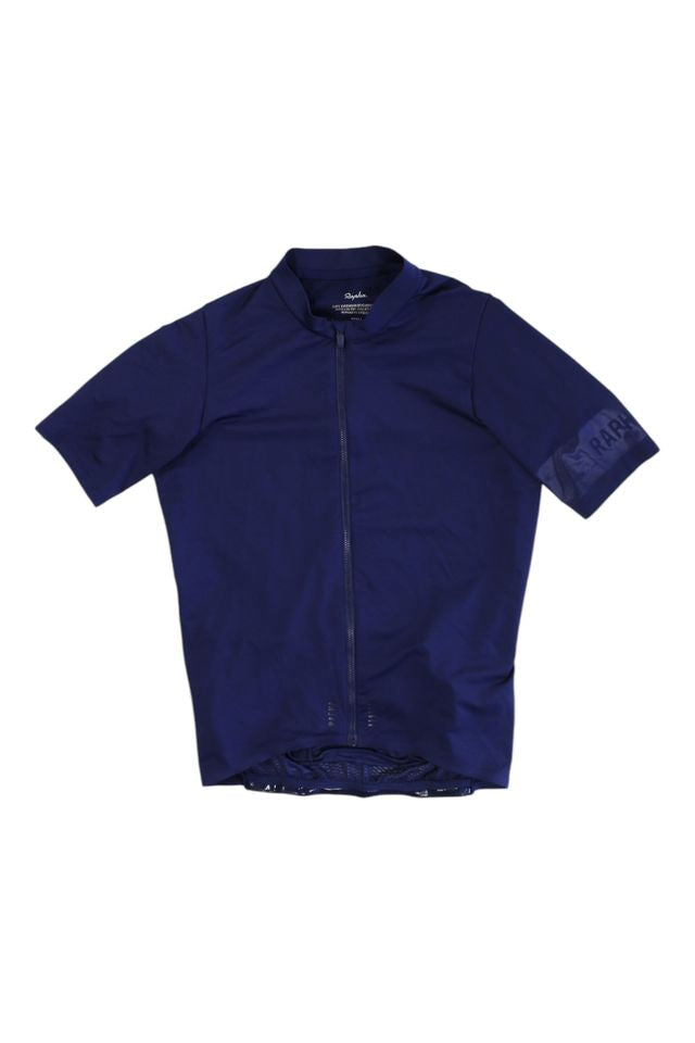 The Mens Pro Team Midweight Short Sleeve Jersey is a navy blue cycling jersey for men, featuring a front zipper and subtle Rapha branding on the left sleeve.