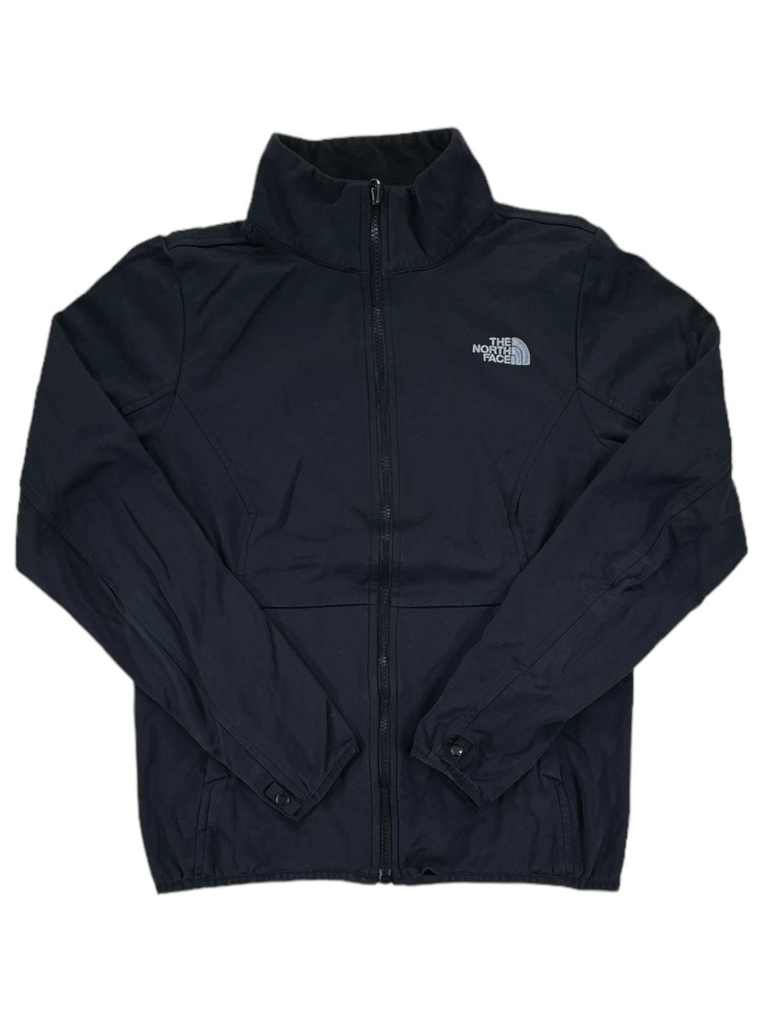 A black Women's Arrowood Triclimate Jacket Inner Fleece Jacket with full front zipper, long sleeves, North Face logo on the left chest, high collar, sleek design, and a cozy fleece liner for added warmth.
