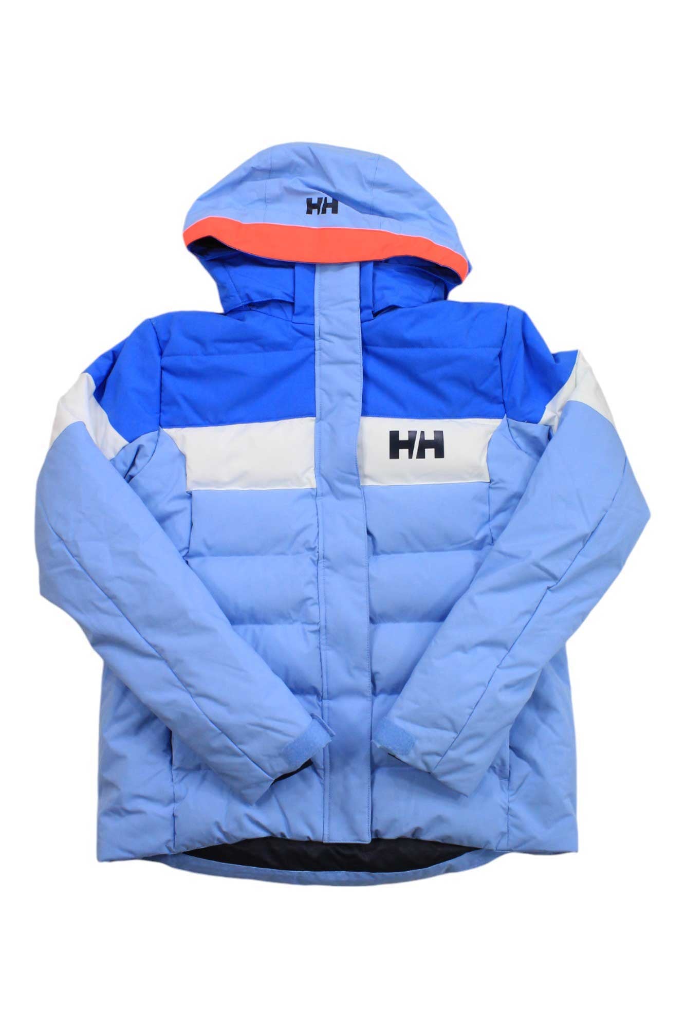 The Helly Hansen Juniors Diamond Jacket is a blue and light blue girls' ski jacket with white accents, a hood, and Helly Hansen logos. It features Primaloft insulation, a front zipper, and is designed for cold weather.