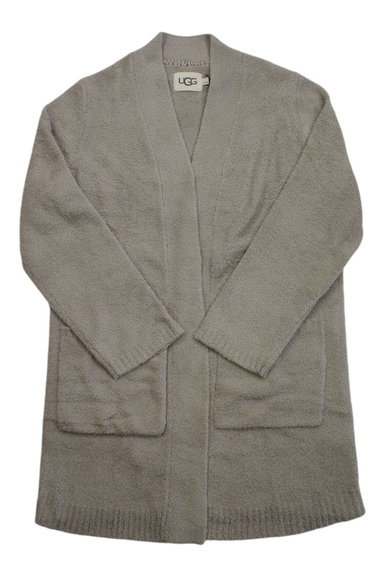 The UGG Womens Kallie Cardigan is a light brown, long-sleeve open knit featuring two large front pockets and soft, textured recycled polyester. The UGG women's cardigan label appears inside the collar.