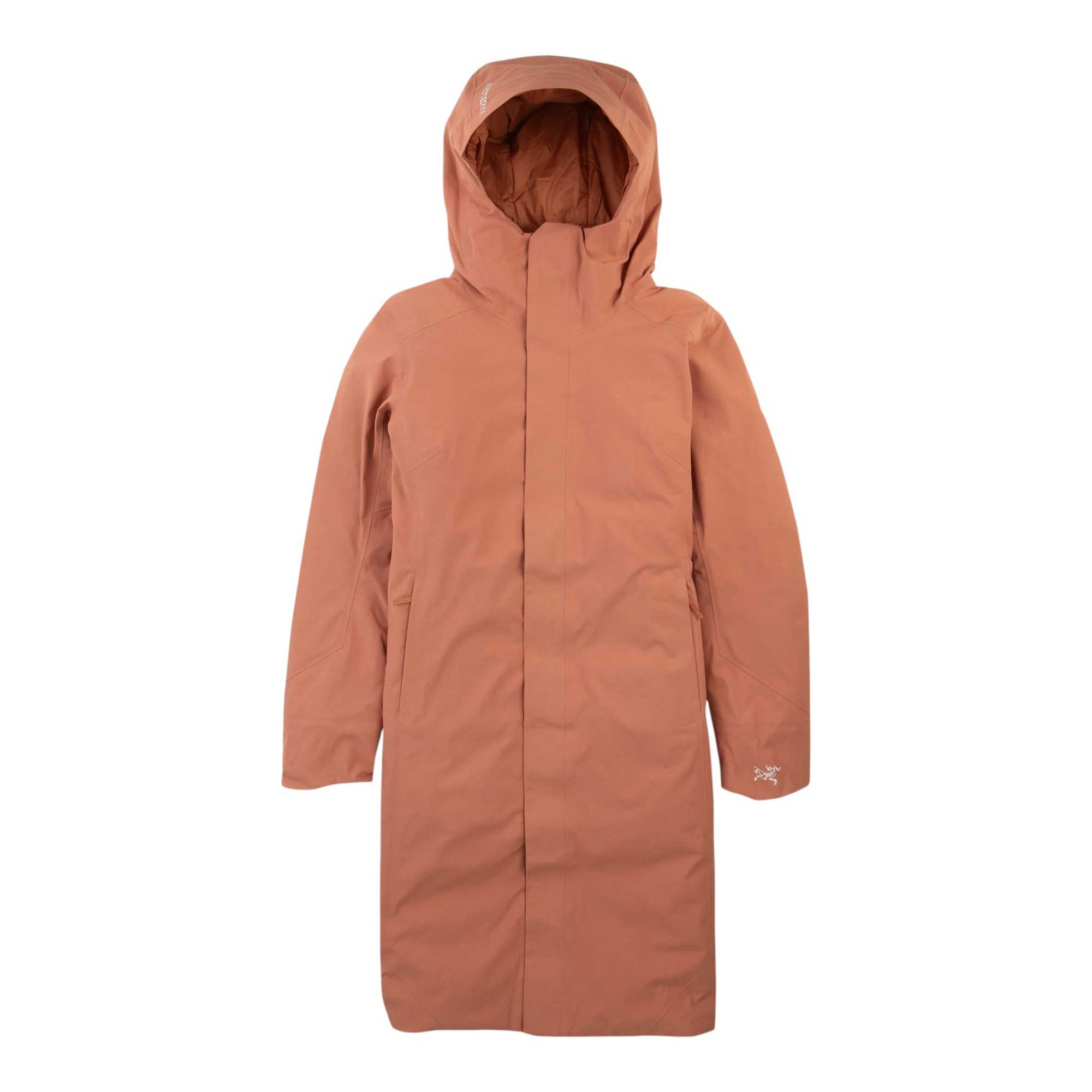 The Arcteryx Womens Patera Parka is a long, hooded, insulated winter coat in muted orange-brown with a front zipper and minimal design, featuring Gore-Tex waterproof technology, shown on a plain white background.