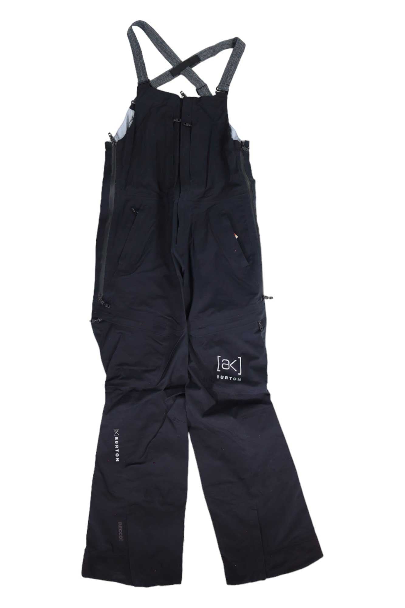 The Burton Womens [ak] Gore-Tex Kimmy Bib Pant features black waterproof fabric, adjustable shoulder straps, zippered pockets, and a white “[ak] BURTON” logo on the left leg—ideal for outdoor or winter sports.