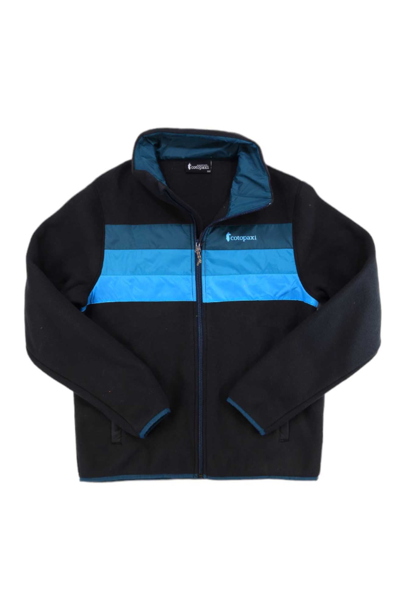 The Cotopaxi Women's Teca Fleece Jacket in black features blue stripes, a small white chest logo, high collar, long sleeves, and is made from recycled polyester—ideal for casual style.