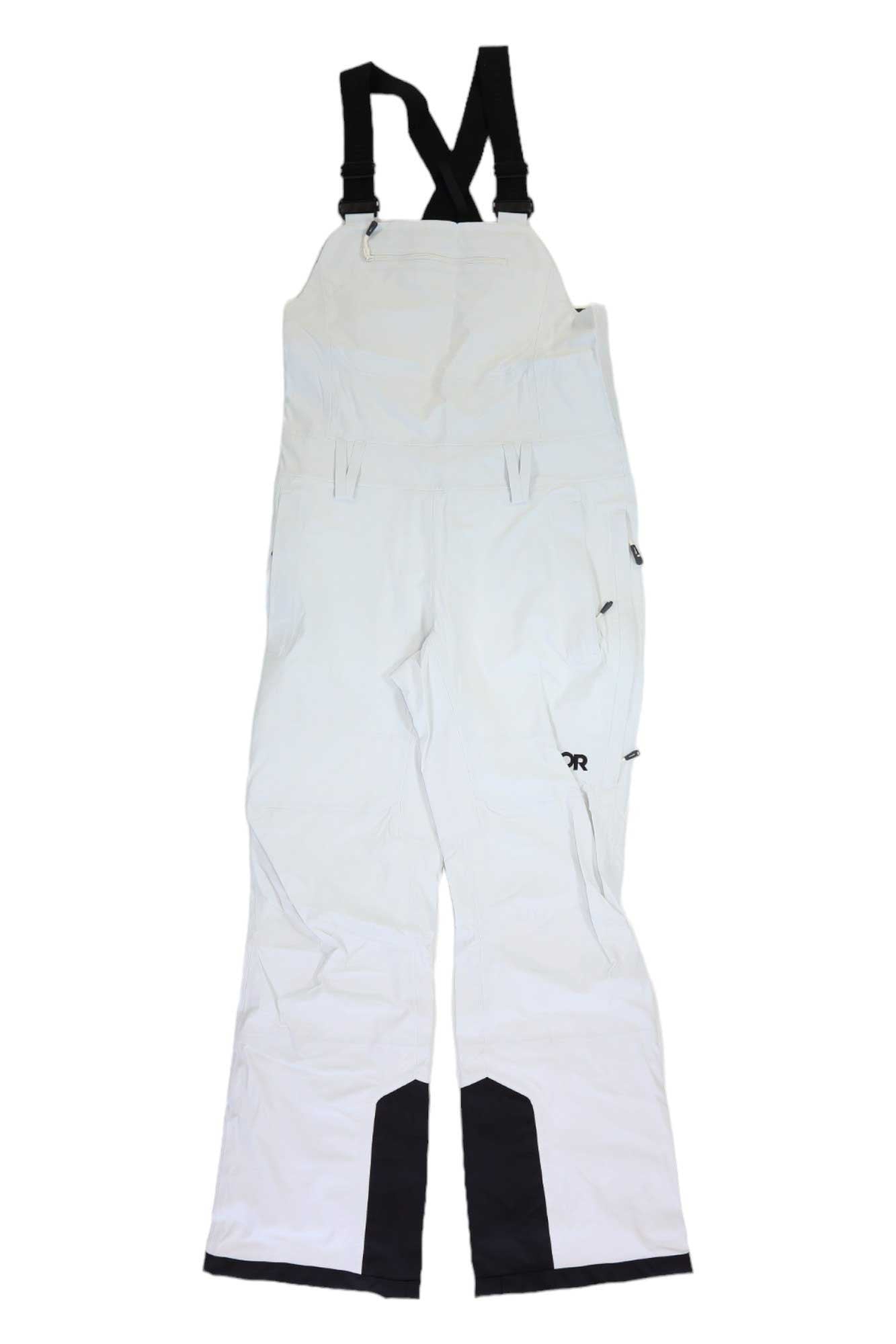 The Outdoor Research Womens Carbide Bib features white waterproof fabric, black adjustable suspenders, reinforced cuffs, and multiple pockets—ideal snowsports apparel for outdoor winter activities.
