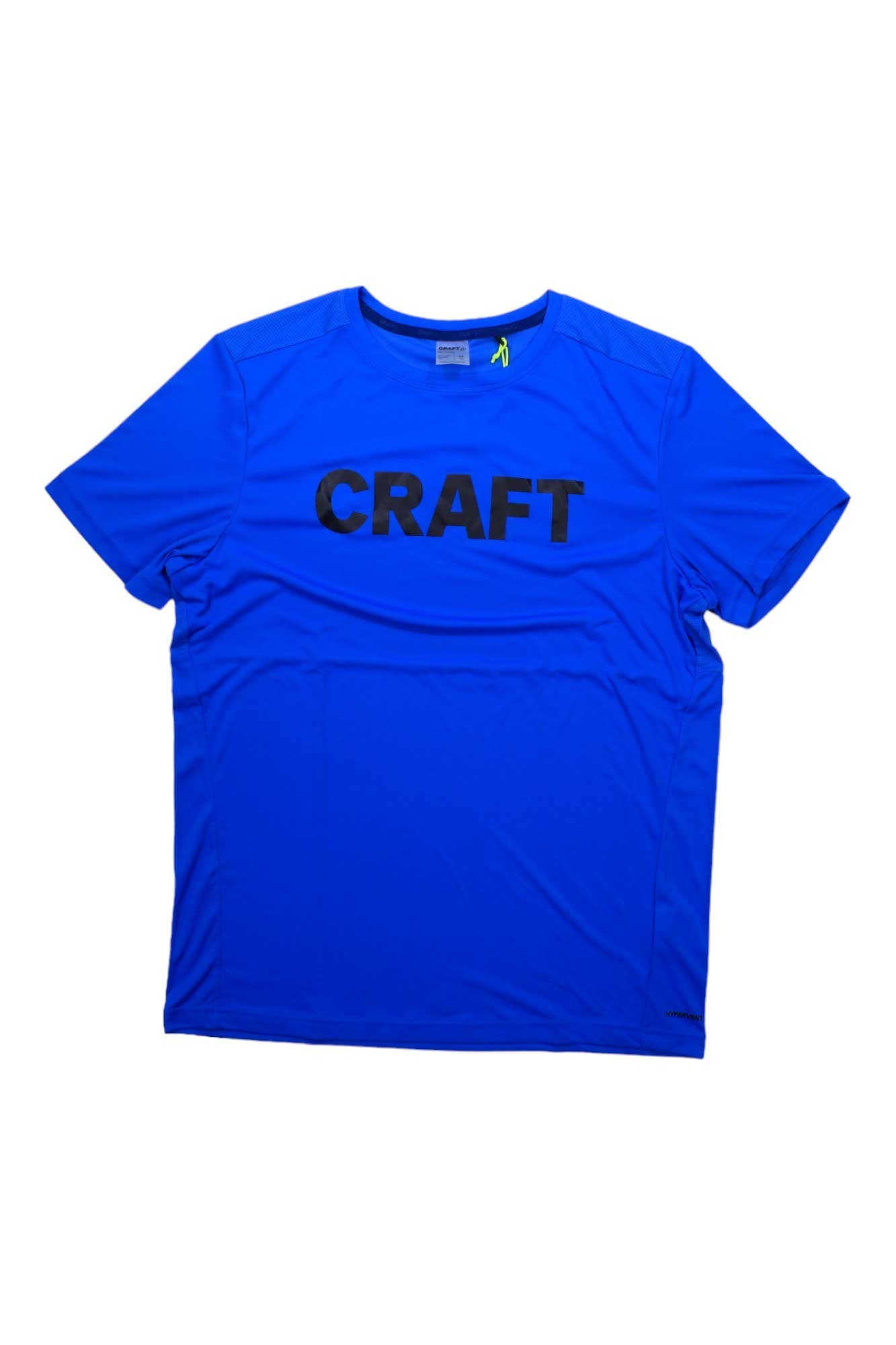 The Craft Sportswear Men's Core Charge SS Tee is a bright blue polyester crew shirt with short sleeves and bold black "CRAFT" lettering across the chest, displayed flat on a white background.