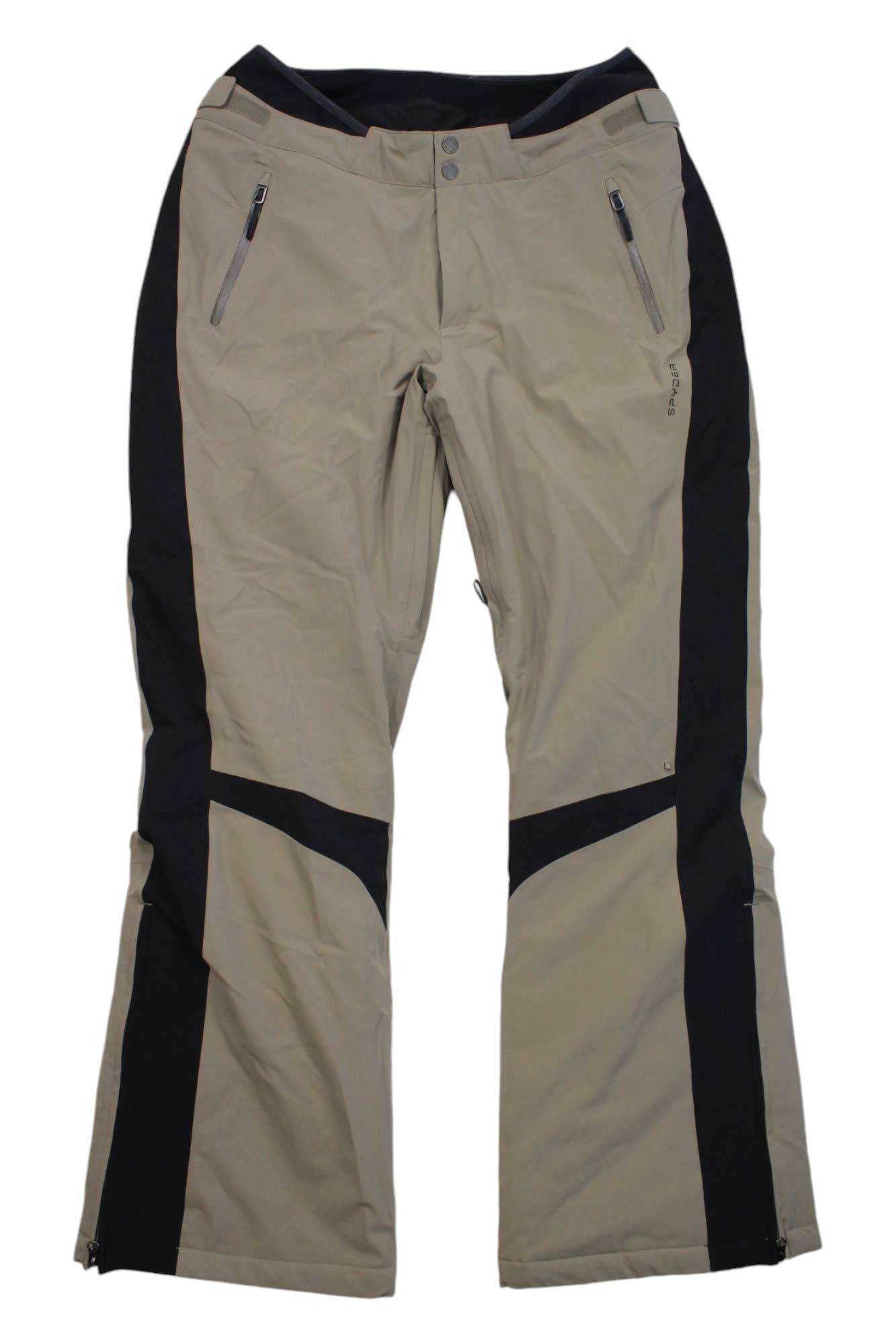 The Spyder Womens Echo Pant in khaki features black side panels, two front zippered pockets, a button and zipper waist closure, slightly flared leg design, and visible seam details—perfect as stylish women's ski pants.