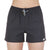 A person wears Moosejaw Womens THE Moosejaw Short in black, featuring water-resistant fabric, an elastic waistband with drawstring, and a small logo patch near the left hem. The background is plain white.