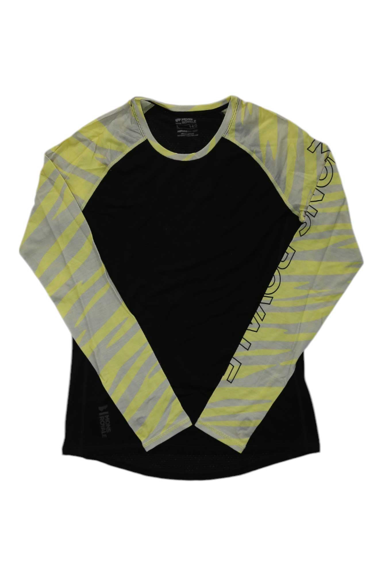 The Mons Royale Womens Bella Tech LS Top is a long sleeve fitness top with a black body, yellow-gray zebra-striped sleeves, and crew neckline. The left sleeve has vertical text near the shoulder. Made from soft Merino wool for comfort and performance.